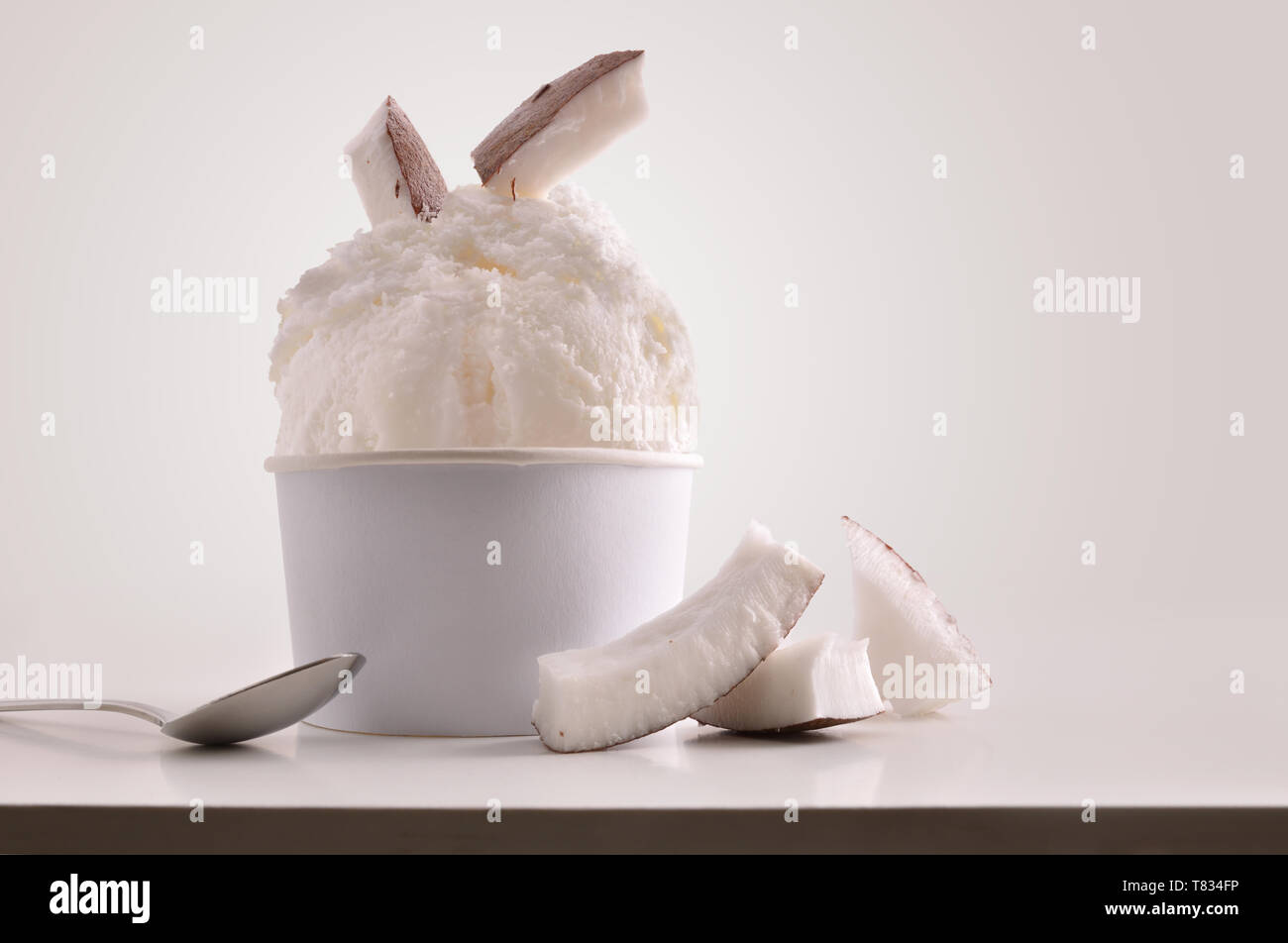 Ice cream balls in paper cup isolated on white background Stock Photo -  Alamy