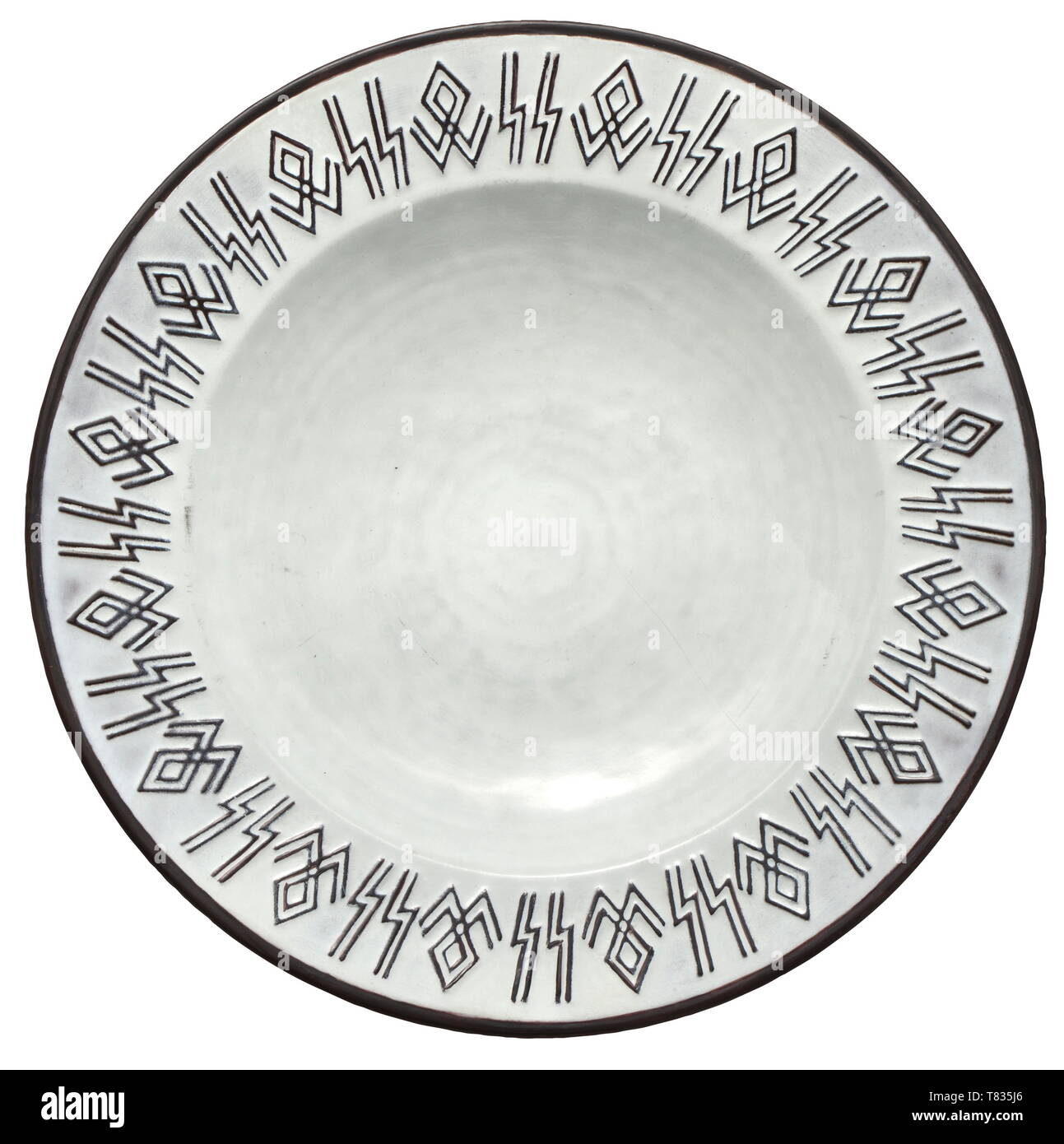 A Christmas wall plate Grey glazed stoneware with a frieze of runes around the border (brown glazed). The bottom with blue underglaze manufacturer's mark and brown inscription in relief 'Der Chef des SS-Hauptamtes 24. 12. 41'. Slightly scratched. Diameter circa 30.5 cm. Very rare. historic, historical, 20th century, 1930s, 1940s, Waffen-SS, armed division of the SS, armed service, armed services, NS, National Socialism, Nazism, Third Reich, German Reich, Germany, military, militaria, utensil, piece of equipment, utensils, object, objects, stills, clipping, clippings, cut ou, Editorial-Use-Only Stock Photo
