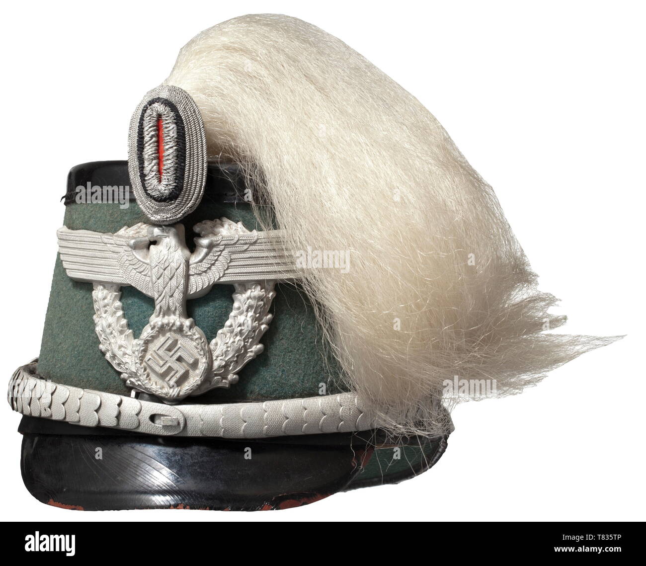 An officer's shako of the uniformed police with parade plume Leather skull with police green felt cover (insect damages on the right), black lacquered peaks and top, ochre leather sweatband with silk rep lining. One-piece aluminium eagle, field insignia of silver weave, silver-plated chinscales, white buffalo hair plume. Signs of usage and age. Size 58. historic, historical, 20th century, Additional-Rights-Clearance-Info-Not-Available Stock Photo