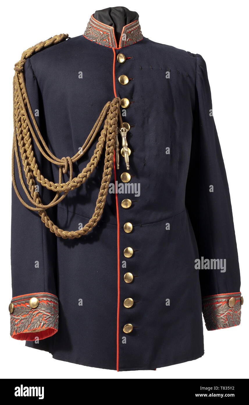 A field marshal´s tunic Circa 1860. Fine blue wool cloth, red piping, gold buttons (stamped 'Extra Fein' on the reverse), braided shoulder boards of gold bullion with two applied crossed silver marshal´s batons, attached to it a gold bullion aiguillette with crowned ferrules (traces of gilding). Collar and cuffs of fine red wool cloth with oak leaf embroidery made of silver threads (traces of gilding). The coat tails with red piping, three gold buttons and oak leaf embroidery. Red lining (label 'Deutscher Offizier-Verein') and white sleeve lining, Additional-Rights-Clearance-Info-Not-Available Stock Photo