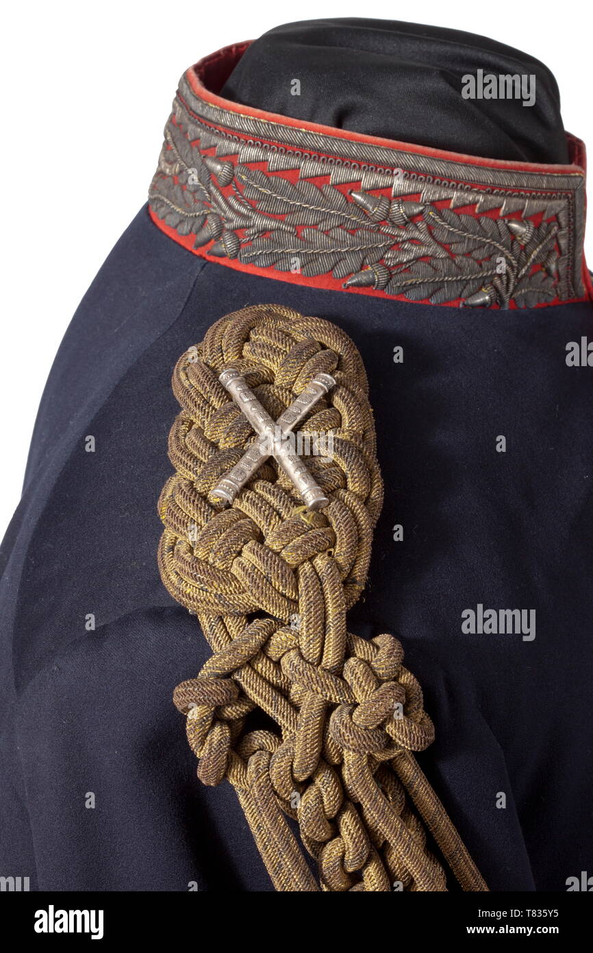 A field marshal´s tunic Circa 1860. Fine blue wool cloth, red piping, gold buttons (stamped 'Extra Fein' on the reverse), braided shoulder boards of gold bullion with two applied crossed silver marshal´s batons, attached to it a gold bullion aiguillette with crowned ferrules (traces of gilding). Collar and cuffs of fine red wool cloth with oak leaf embroidery made of silver threads (traces of gilding). The coat tails with red piping, three gold buttons and oak leaf embroidery. Red lining (label 'Deutscher Offizier-Verein') and white sleeve lining, Additional-Rights-Clearance-Info-Not-Available Stock Photo