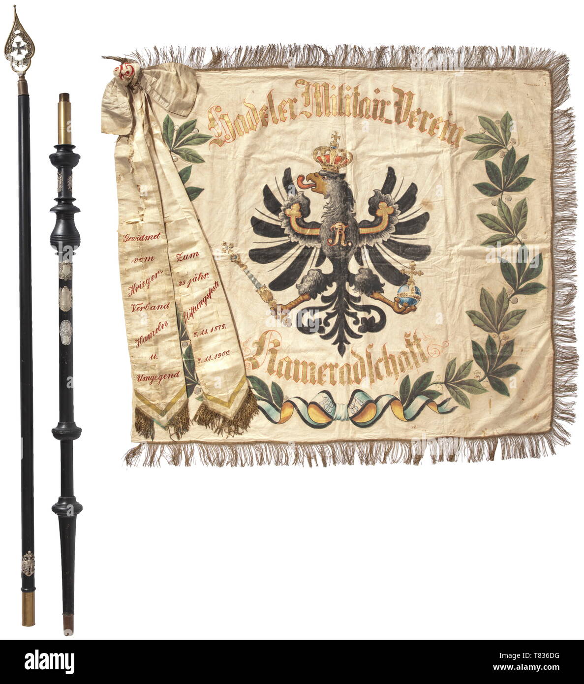 A flag of the veterans´ association of the Infantry Regiment no. 77 The Regiment '2. Hannoversche' was established with its base in Celle in 1813. The flag of polychrome silk cloth with gold fringe border, embroidered inscriptions 'Verein ehemaliger 77er - Hamburg und Umgebung' and 'Mit Gott für Kaiser und Reich - 1901 - 2. Hannov. Inf. R. 77', size circa 130 x 140 cm. With flag pole of blackened hard wood, collapsible into two pieces. Brass finial, pierced with soldered-in multi-part Iron Cross of 1914. On the pole a total of nine mounted flag n, Additional-Rights-Clearance-Info-Not-Available Stock Photo