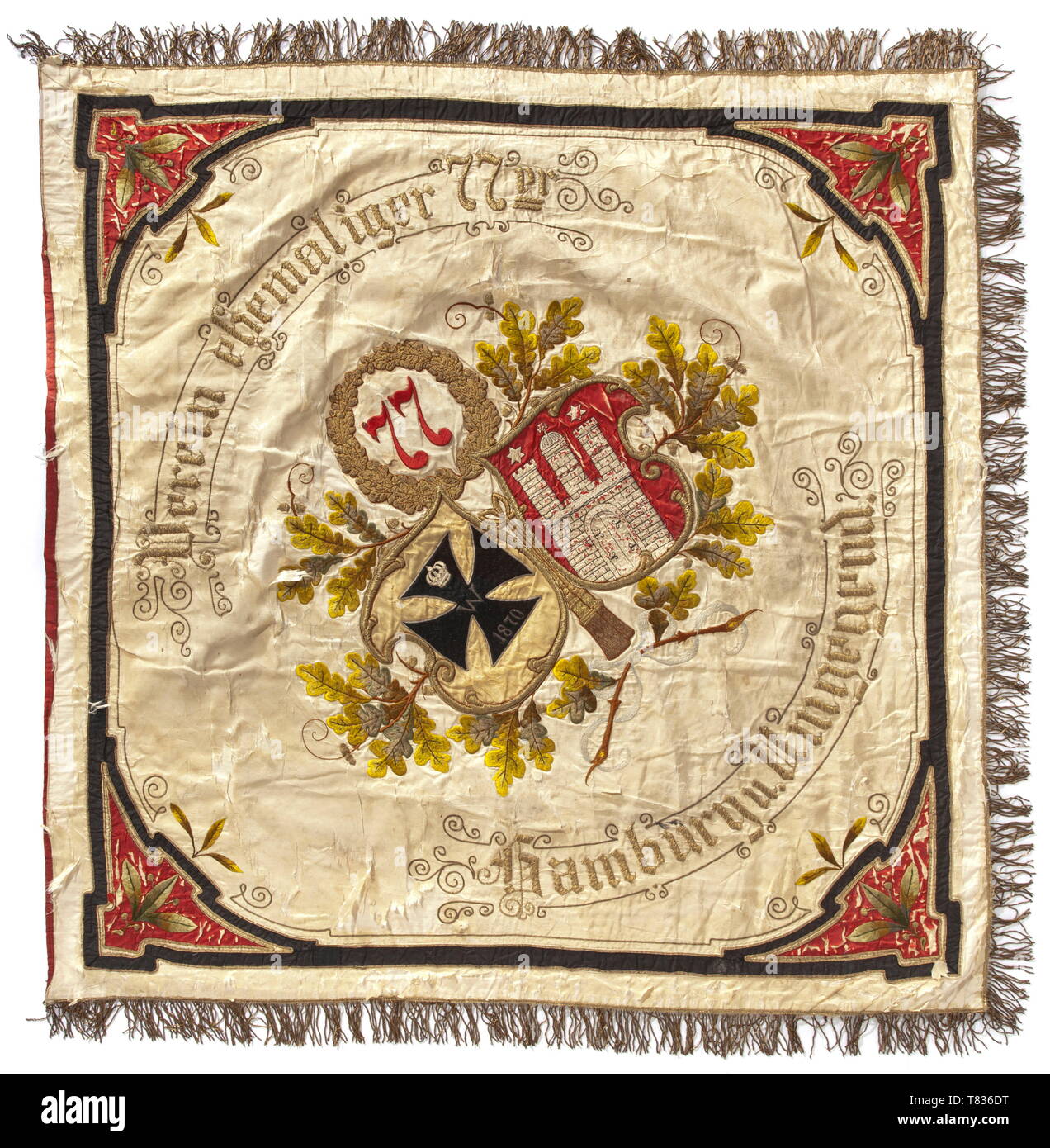 A flag of the veteransÂ´ association of the Infantry Regiment no. 77 The Regiment '2. Hannoversche' was established with its base in Celle in 1813. The flag of polychrome silk cloth with gold fringe border, embroidered inscriptions 'Verein ehemaliger 77er - Hamburg und Umgebung' and 'Mit Gott für Kaiser und Reich - 1901 - 2. Hannov. Inf. R. 77', size circa 130 x 140 cm. With flag pole of blackened hard wood, collapsible into two pieces. Brass finial, pierced with soldered-in multi-part Iron Cross of 1914. On the pole a total of nine mounted flag , Additional-Rights-Clearance-Info-Not-Available Stock Photo