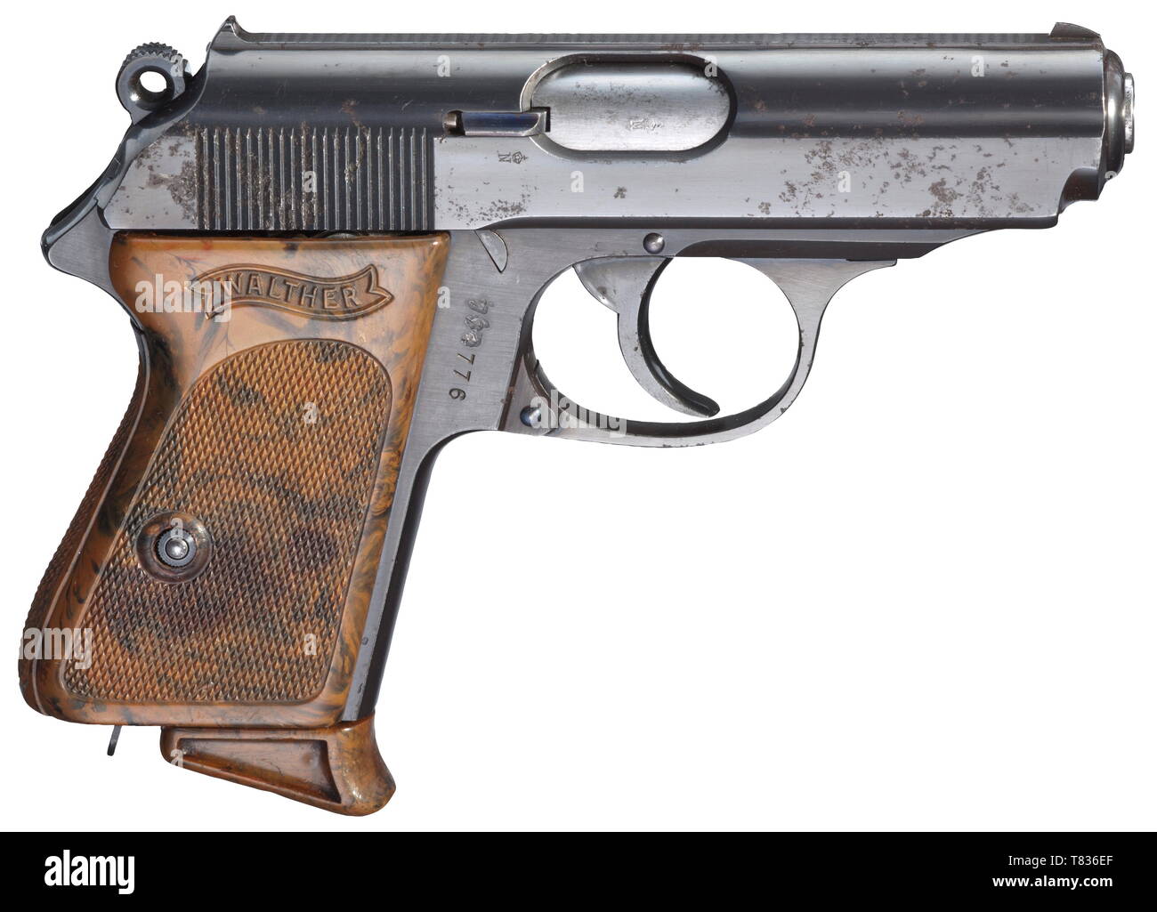 A Walther PPK ZM in cal. 6.35 mm No. 774776, with '774' re-punched. Bright bore. 90Ã¸ safety. Covered firing pin. Still with bore for C-spring for hammer block. Millings for weight reduction on both sides of slide. Standard inscription on slide with calibre '6,35 m/m'. Complete original finish, partially fine pitting on the right. Small parts blue. Mottled brown plastic grip panel. Double-walled special magazine (mod. 8 magazine inside) with one view hole on the left and seven small view holes on the right. Correct early mottled brown extension. , Additional-Rights-Clearance-Info-Not-Available Stock Photo