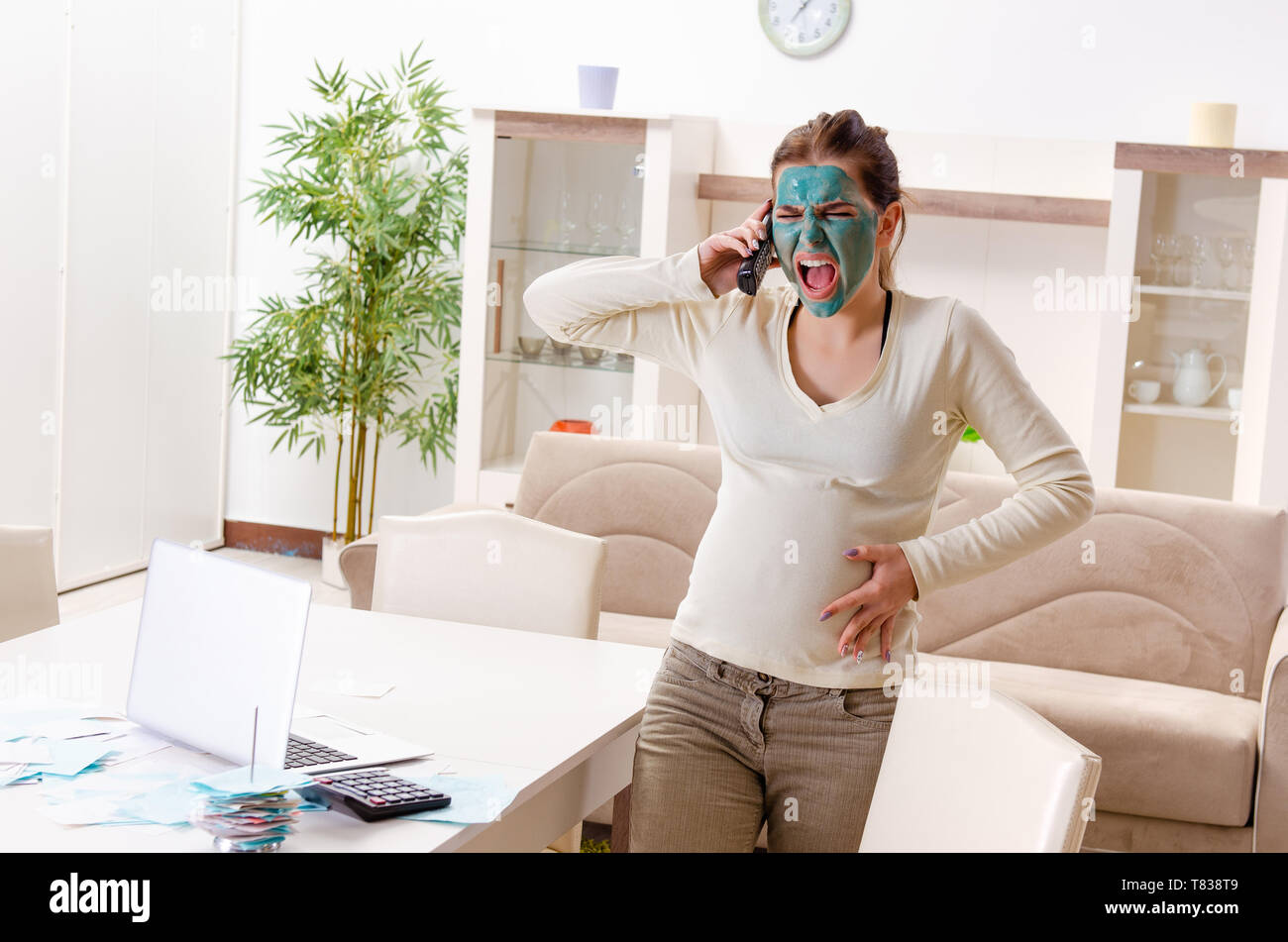 View of Young pregnant woman in budget planning concept Stock Photo - Alamy
