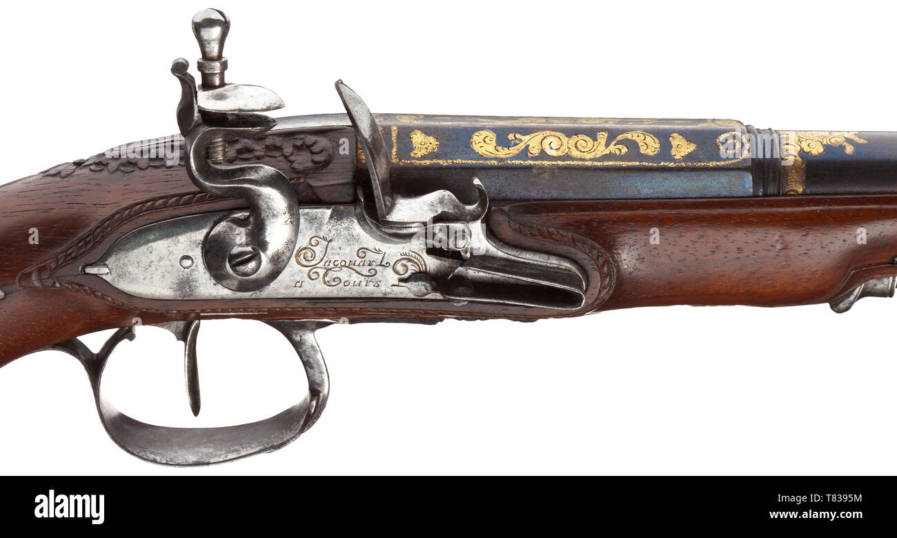 A pair of French flintlock pistols, Jacquard in Tours, circa 1800 Blued two-stage barrels in 14 mm calibre, octagonal then round and smooth after cut girdles, with cannon muzzles. Ornamental gildings at the breeches. The smooth flintlocks each signed 'Jacouard a Tours'. Florally carved walnut stocks with slightly chiselled iron furnitures. Original whalebone ramrods with horn tips, the ends each with an iron bullet puller and jag, respectively. Length 31 cm each. historic, historical, civil handgun, civil handguns, handheld, gun, guns, firearm, f, Additional-Rights-Clearance-Info-Not-Available Stock Photo