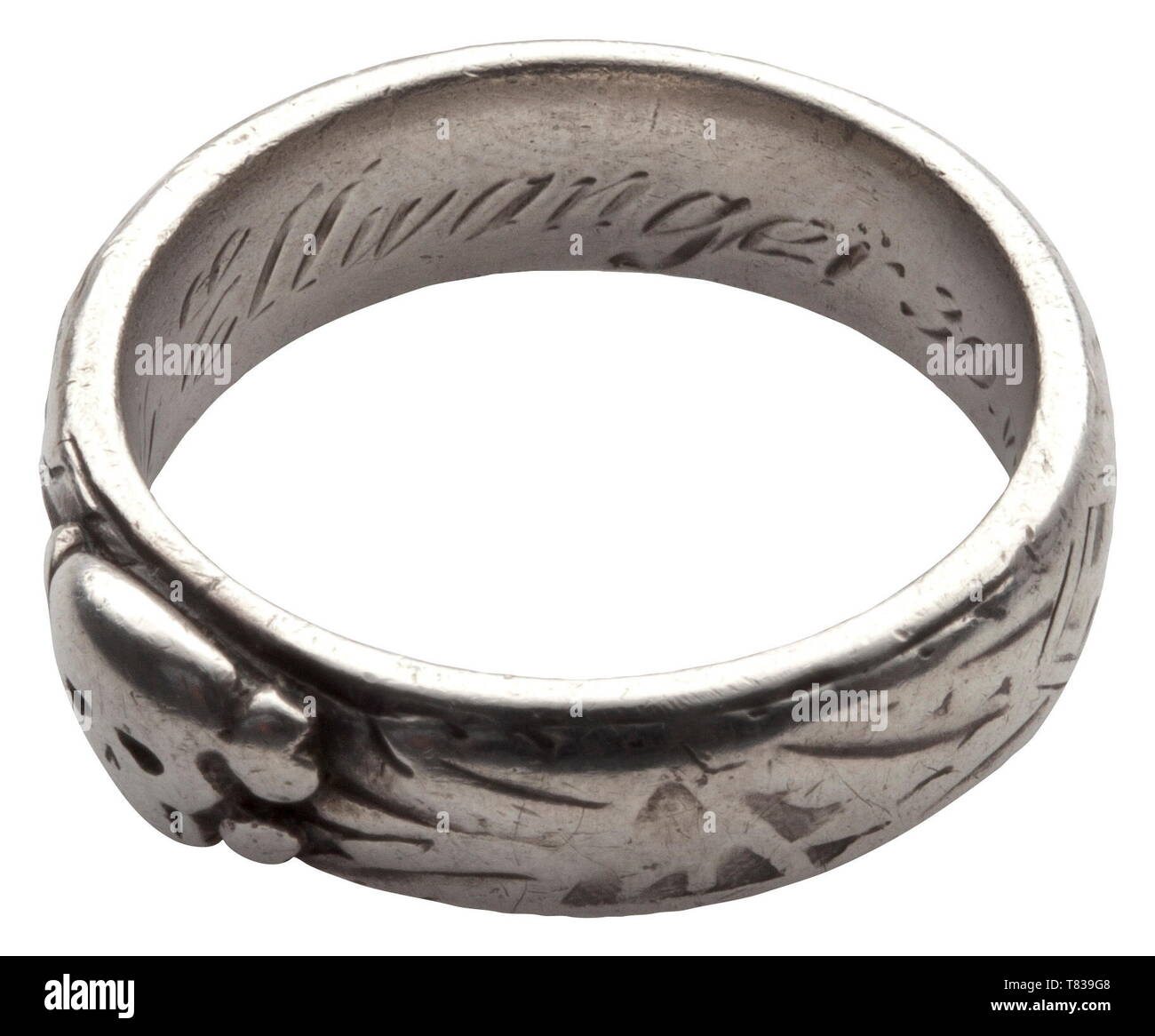 An SS honour ring custom-made by the jeweller Gahr in Munich, soldered underneath the separately applied death's head, the inside surface with engraved dedication 'S.lb. Ellwanger 30.VI.34 H. Himmler'. Weight 9.7 grammes, inside diameter 20 mm, heavily used. The ring comes from family possession and has never been in collectorsÂ´ hands before. historic, historical, 20th century, 1930s, 1940s, Waffen-SS, armed division of the SS, armed service, armed services, NS, National Socialism, Nazism, Third Reich, German Reich, Germany, military, militaria, utensil, piece of equipment, Editorial-Use-Only Stock Photo