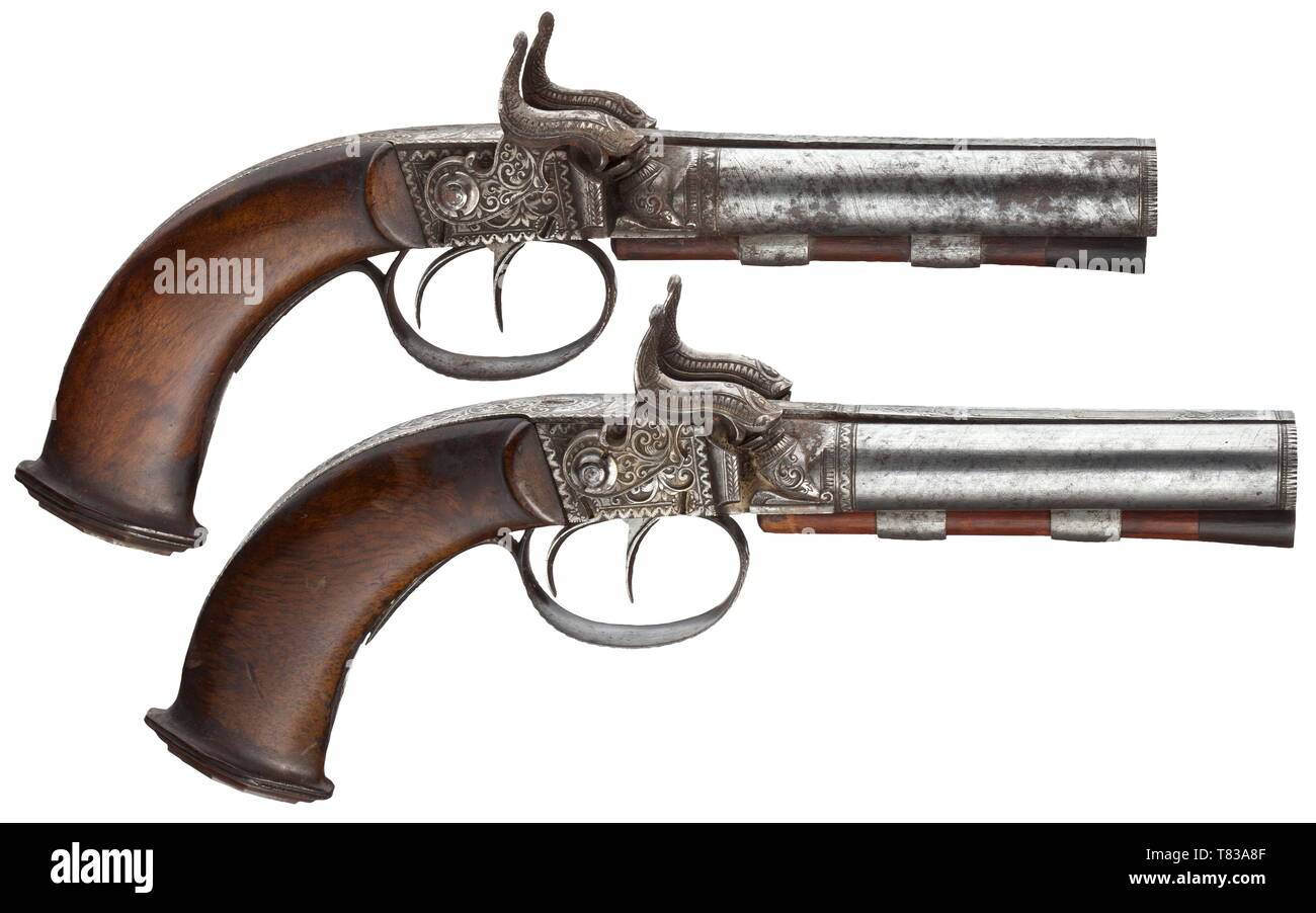 A cased pair of double-barrelled percussion pistols, Escherich in Böhmisch Kamnitz, circa 1850. Parallel Damascus barrels with smooth bores in 11.5 mm calibre, with original wooden ramrods on the underside. The midribs with floral iron chiselling, and each with the gold-inlaid signature 'ESCHERICH' as well as numbered '1' and '2', respectively. Engraved tendrils and hunting scenes on the tangs with inscription 'IN BÖHM. KAMNITZ'. The percussion locks engraved en suite and with iron furnitures (one mechanism defective, probably due to resin). Smoo, Additional-Rights-Clearance-Info-Not-Available Stock Photo