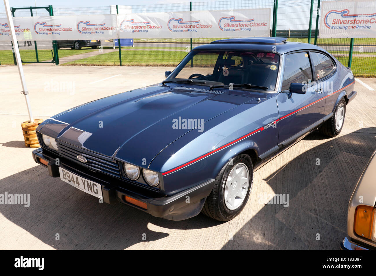Three-quarters front  view of a Blue, 1984, Ford Capri , part of the 50th Anniversary celebrations at the 2019 Silverstone Classic Media Day Stock Photo