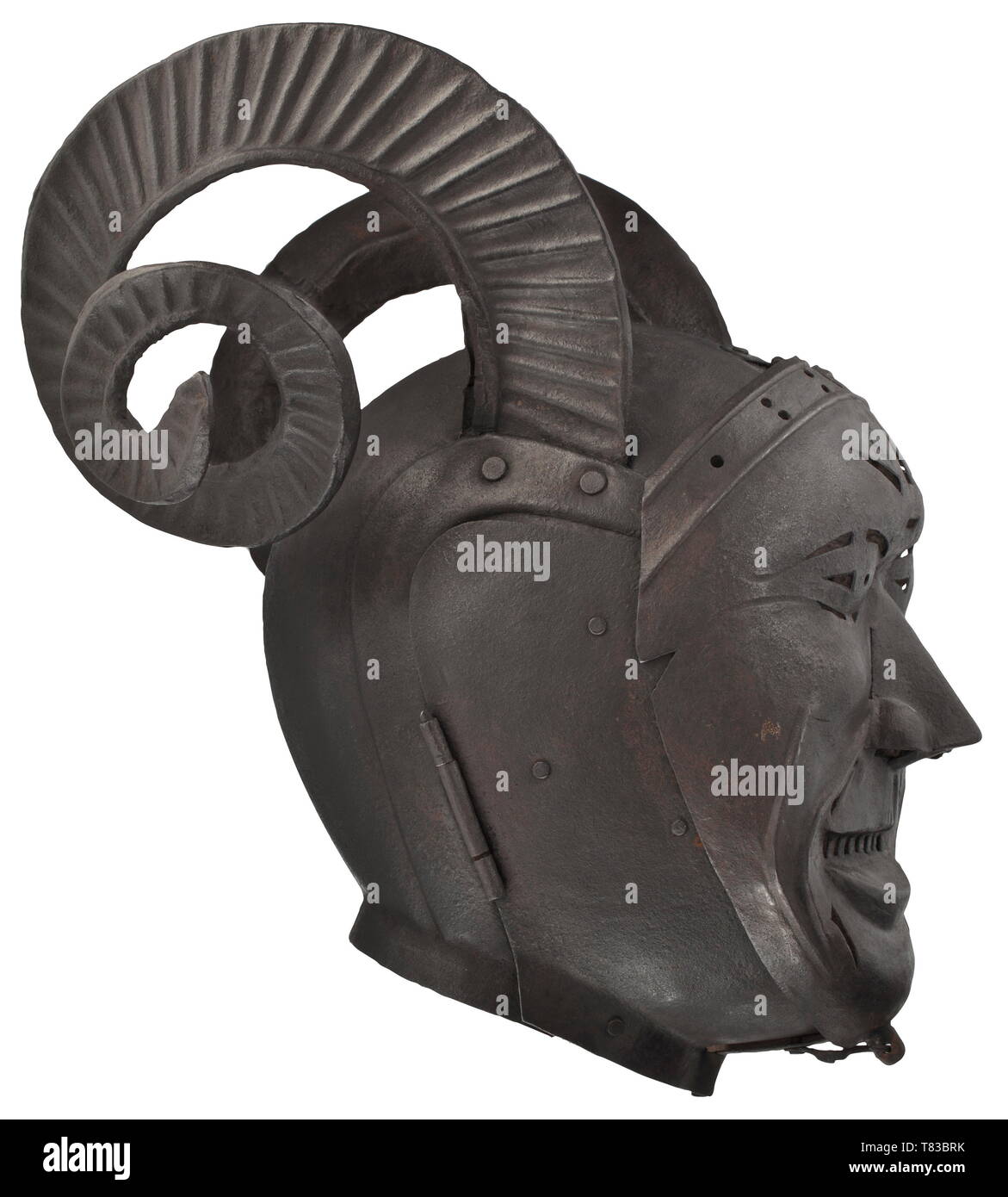 A brank, or mask of shame Horned helmet in the style of an armet with 'Schembart' visor, made for a collector and modelled after an original dating from the 16th century. Two-piece hammered skull with riveted, spirally twisted iron ram´s horns. Hinged two-piece bevor. Hinged, multiply pierced visor in the shape of a male face. Even, dark patina. Height 40 cm, width 37 cm. This elaborate piece was designed after an armet housed today in the Royal Armouries in Leeds. That helmet was made between 1511 and 1514 by the Innsbruck armourer Konrad Seusen, Additional-Rights-Clearance-Info-Not-Available Stock Photo