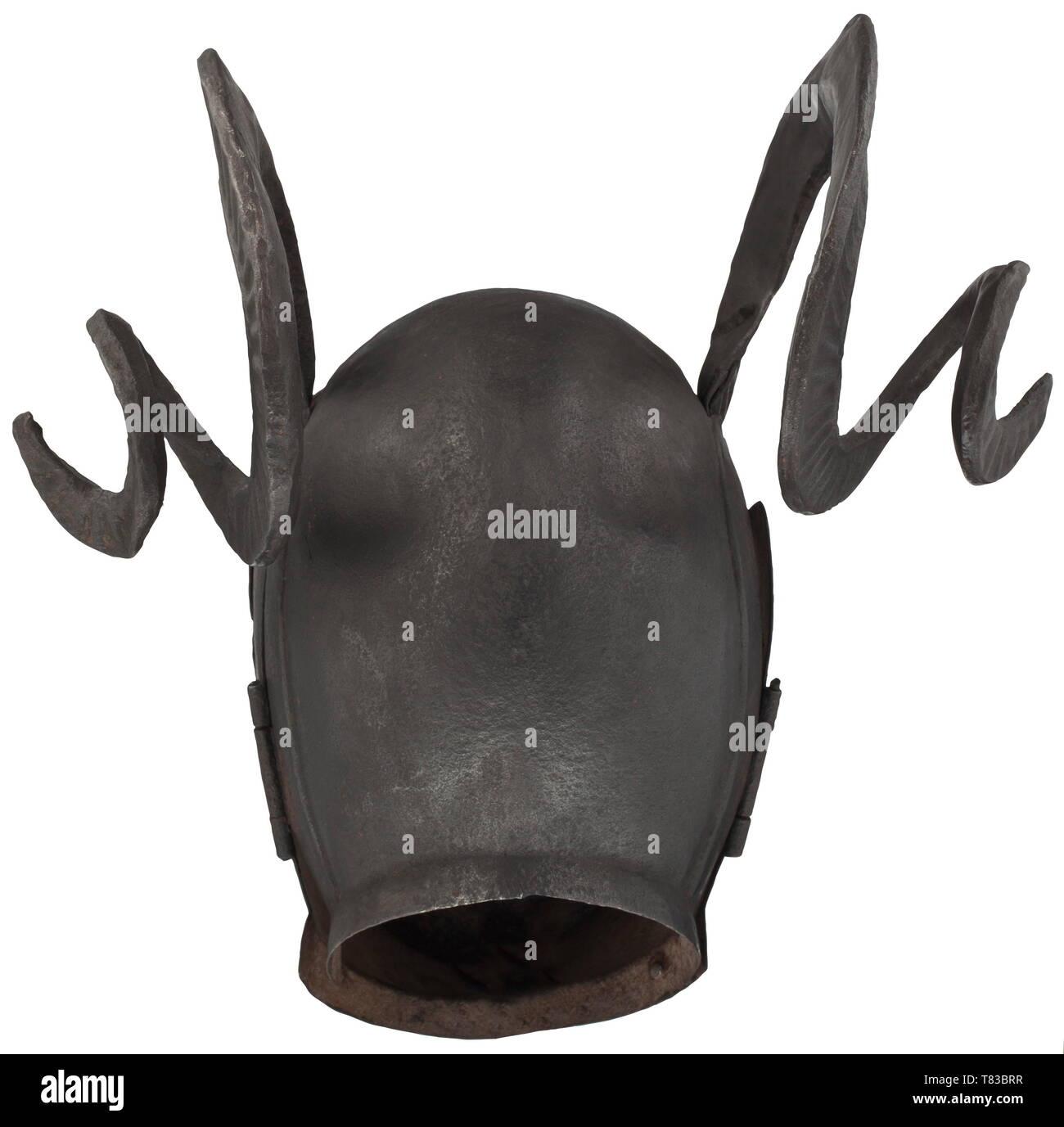 A brank, or mask of shame Horned helmet in the style of an armet with 'Schembart' visor, made for a collector and modelled after an original dating from the 16th century. Two-piece hammered skull with riveted, spirally twisted iron ram's horns. Hinged two-piece bevor. Hinged, multiply pierced visor in the shape of a male face. Even, dark patina. Height 40 cm, width 37 cm. This elaborate piece was designed after an armet housed today in the Royal Armouries in Leeds. That helmet was made between 1511 and 1514 by the Innsbruck armourer Konrad Seusen, Additional-Rights-Clearance-Info-Not-Available Stock Photo