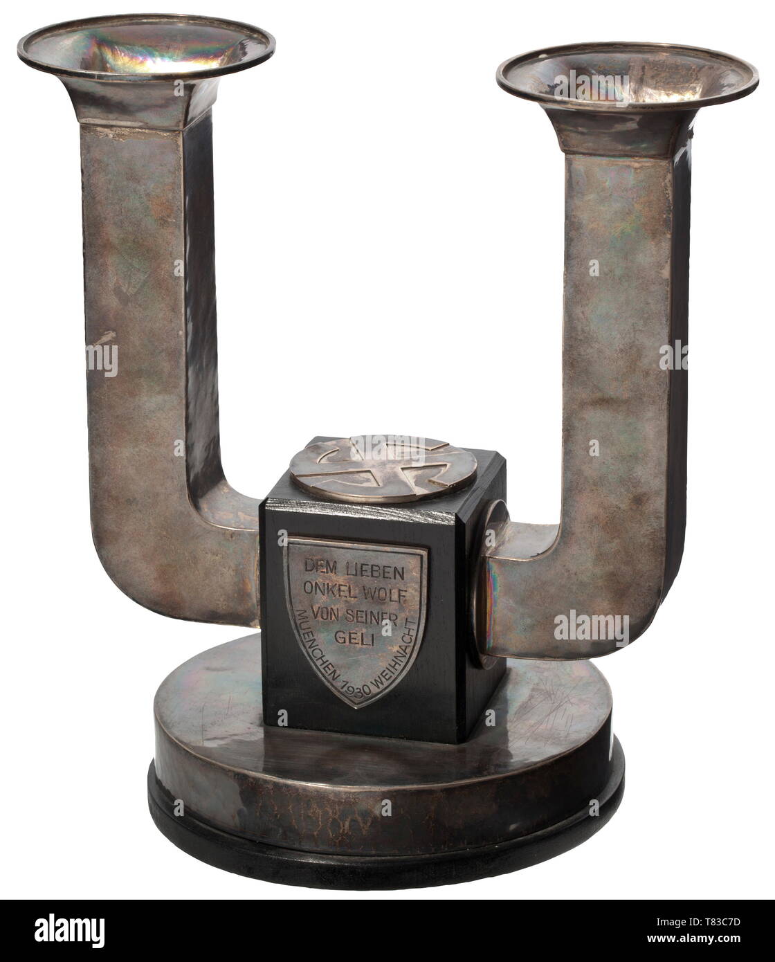 Angela 'Geli' Raubal (1908 - 1931) - a silver candlestick, a present to Adolf Hitler In Art Deco style, the surface with fine hammer marks, the central section of dark wood with swastika applied at top, engraved Munich coat of arms at front, gift inscription (tr.) 'To my dear Uncle Wolf from his Geli - Munich 1930 - Christmas' at back. Silver smith mark 'CW' beside the towers of the Frauenkirche for the Munich silversmith Carl Weishaupt, also jeweller's inscription (tr.) 'handmade' and mark of fineness '925'. Flat blackened base. Height 21 cm, weight 1046 g. Carl Weishaupt,, Editorial-Use-Only Stock Photo