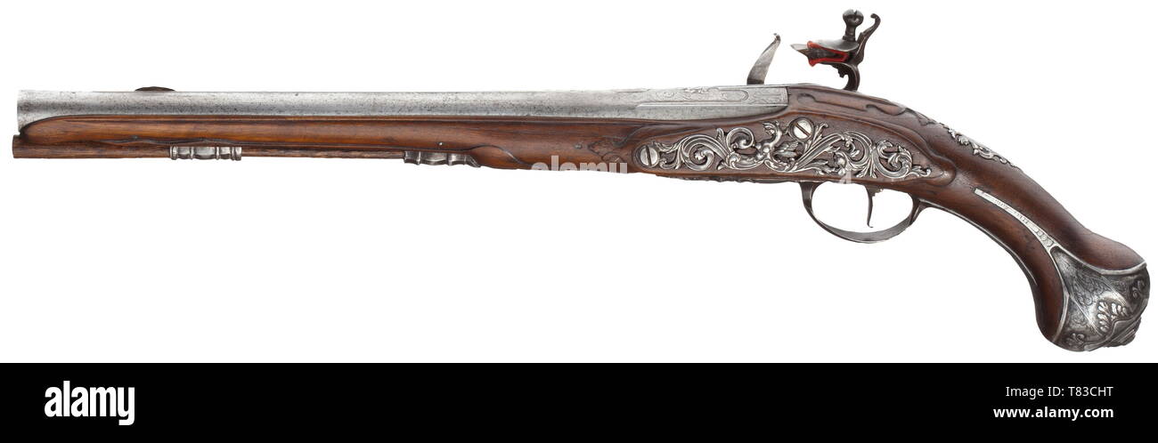 A Flemish flintlock pistol, circa 1730 Smooth barrel in 16.5 mm calibre, with barrel rib on top, chiselled and engraved at the breech. The flintlock is decorated en suite. Walnut full stock with finely chiselled, partly openwork iron furniture. Wooden ramrod. Slightly reworked. Length 53 cm. historic, historical, civil handgun, civil handguns, handheld, gun, guns, firearm, fire arm, firearms, fire arms, weapons, arms, weapon, arm, 18th century, Additional-Rights-Clearance-Info-Not-Available Stock Photo