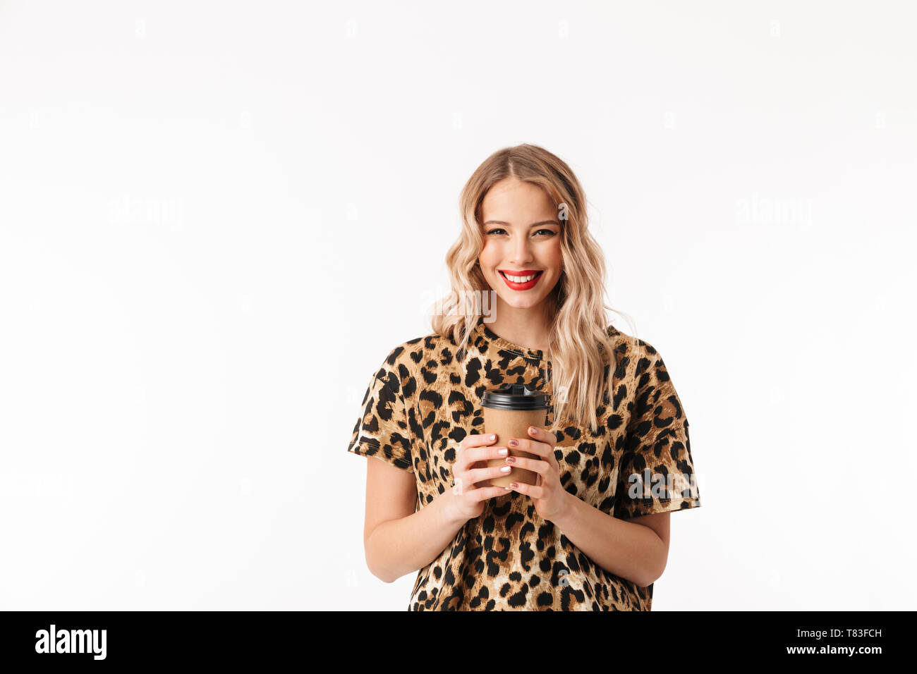 Coffee On The Go. Beautiful Young Woman Holding Coffee Cup And