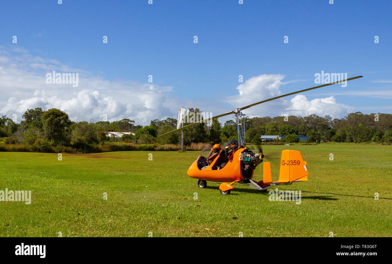 Takeoff of a gyrocopter on an grass airfield in Bayron Bay, Queensland