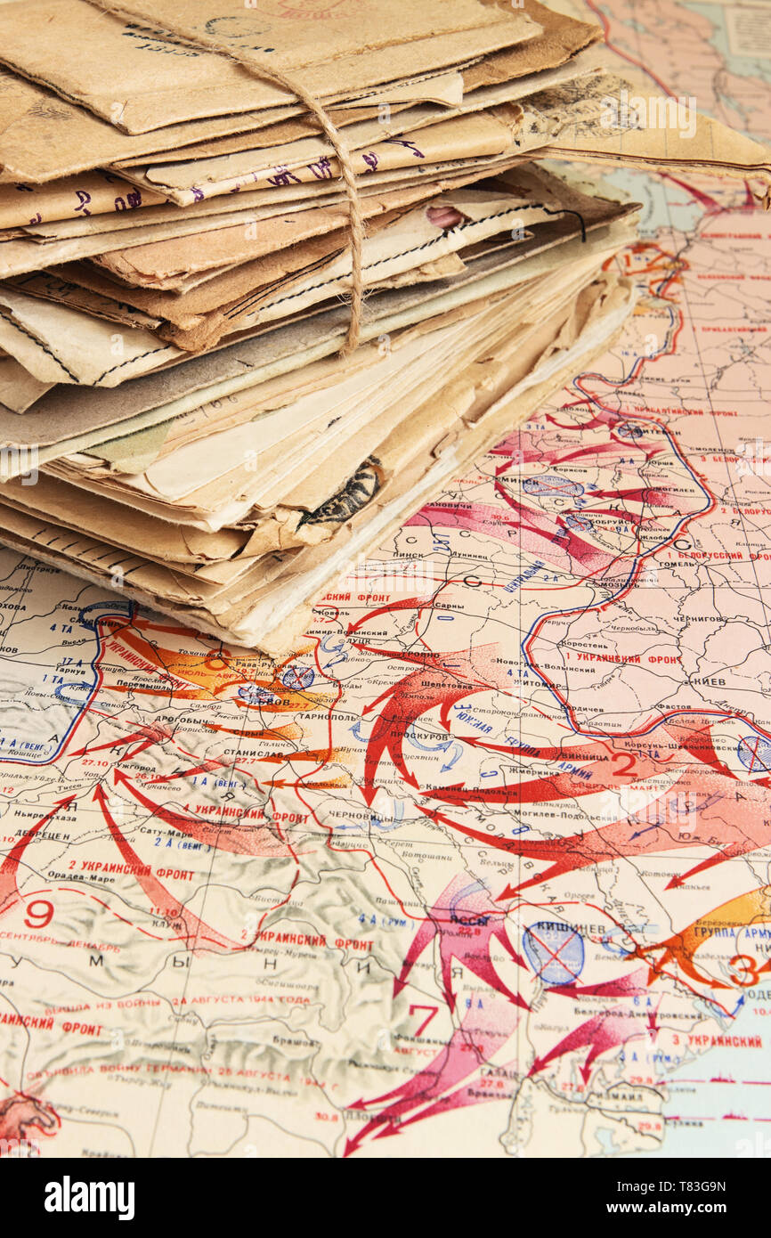 Sheaf of the paper letters of the wartime lying on the military map of the World War II, 1944 Stock Photo