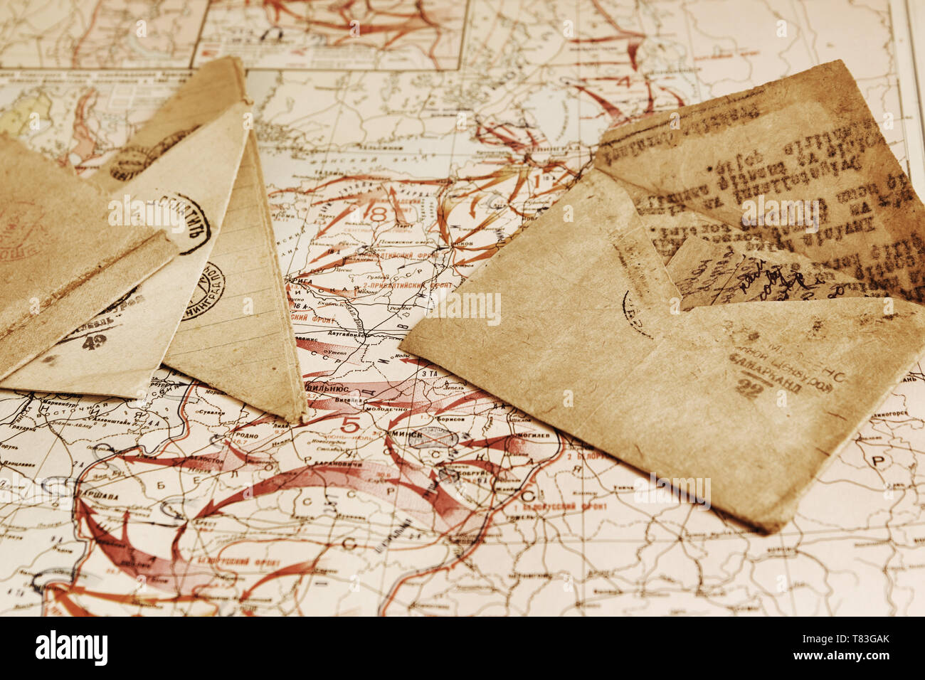 Several of the old envelopes with the letters of the war of time lying on the military map of the World War II, 1944 Stock Photo