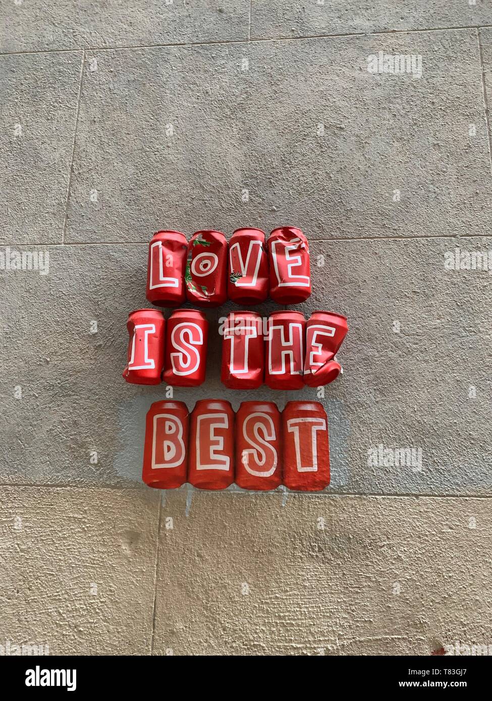 Uplifting Street Art Installation made out of recycled Coca Cola cans with a message of love Stock Photo