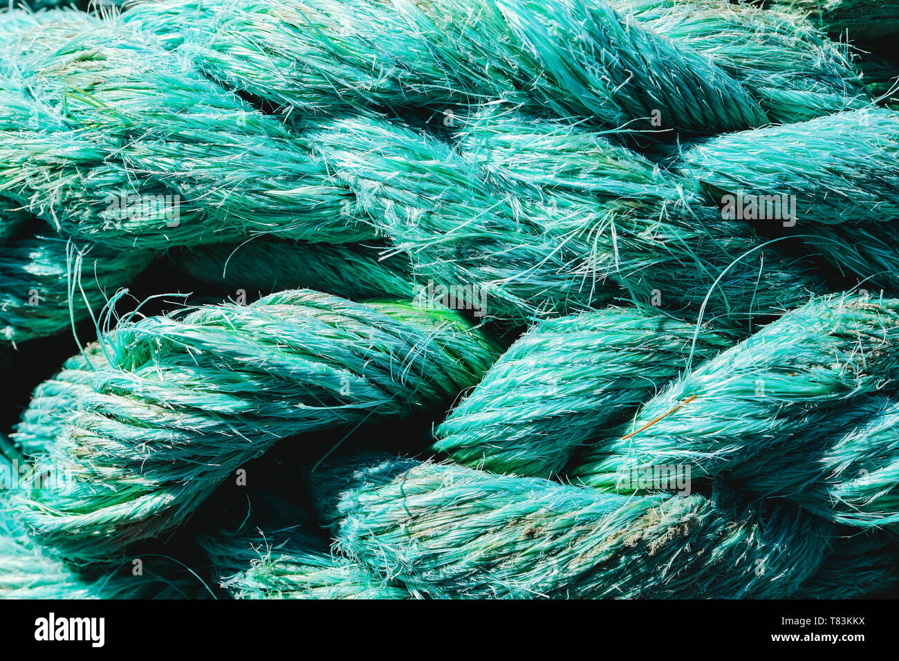 Big fat blue mooring rope texture. Nautical marine background. Stock Photo