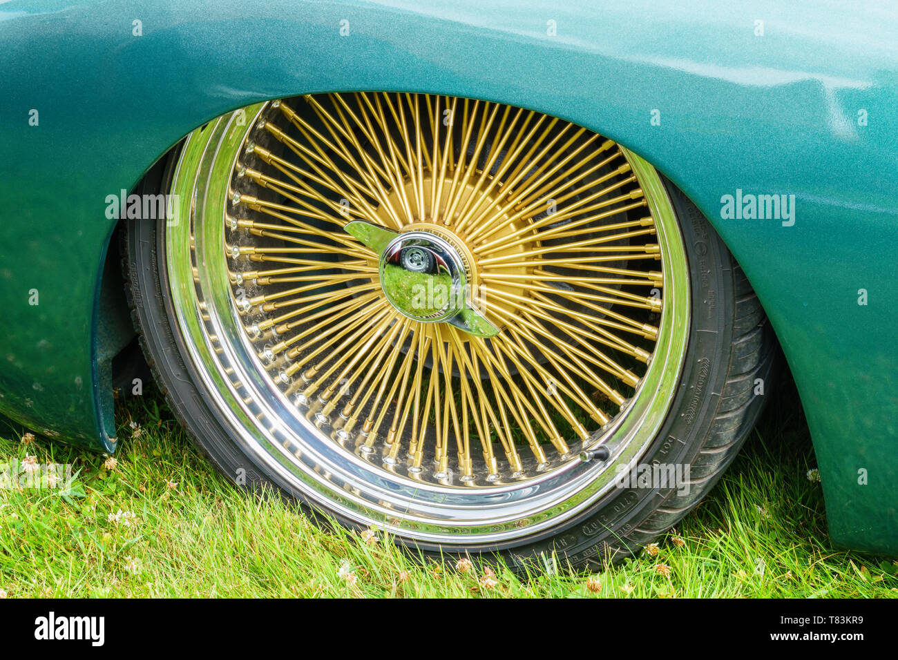 Car with gold colors spoke rims Stock Photo Alamy