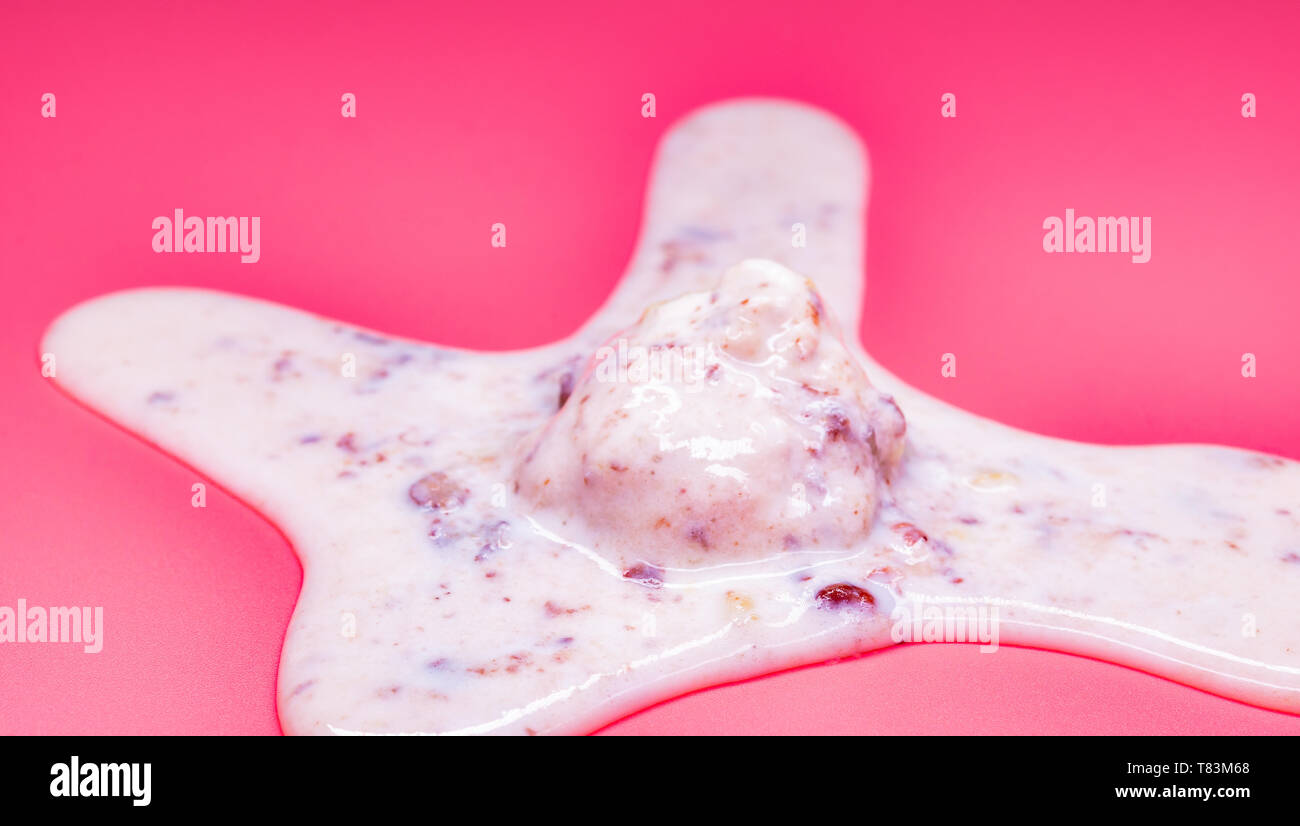 side view chestnut and red bean ice cream ball in a melting process on