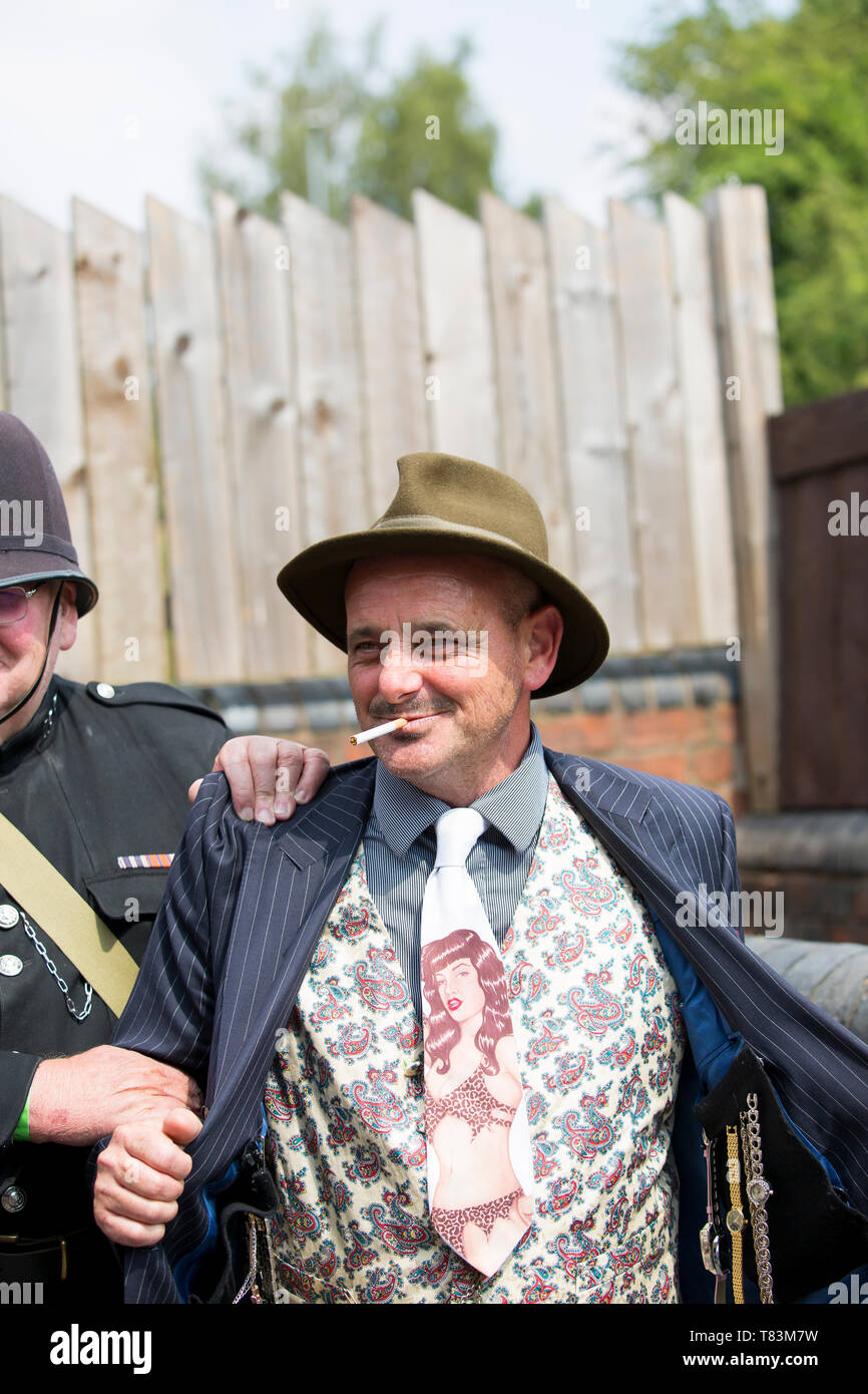 Black Country Living Museum, 1940's wartime weekend, summer 2018. Spiv being arrested by vintage British bobbies on the beat. Stock Photo