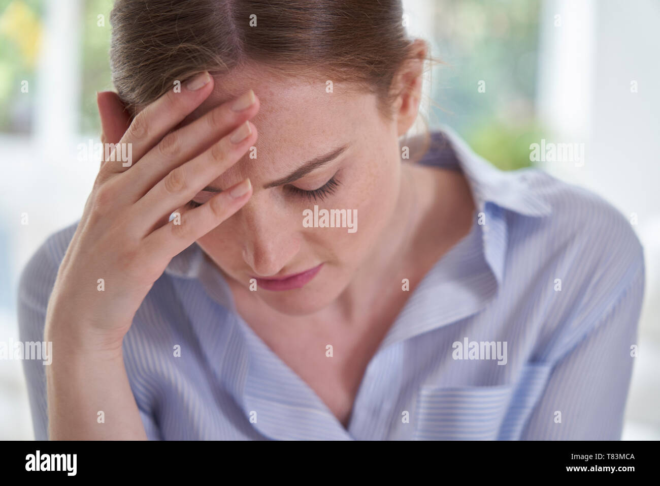 Woman head in hands sad hi-res stock photography and images - Alamy