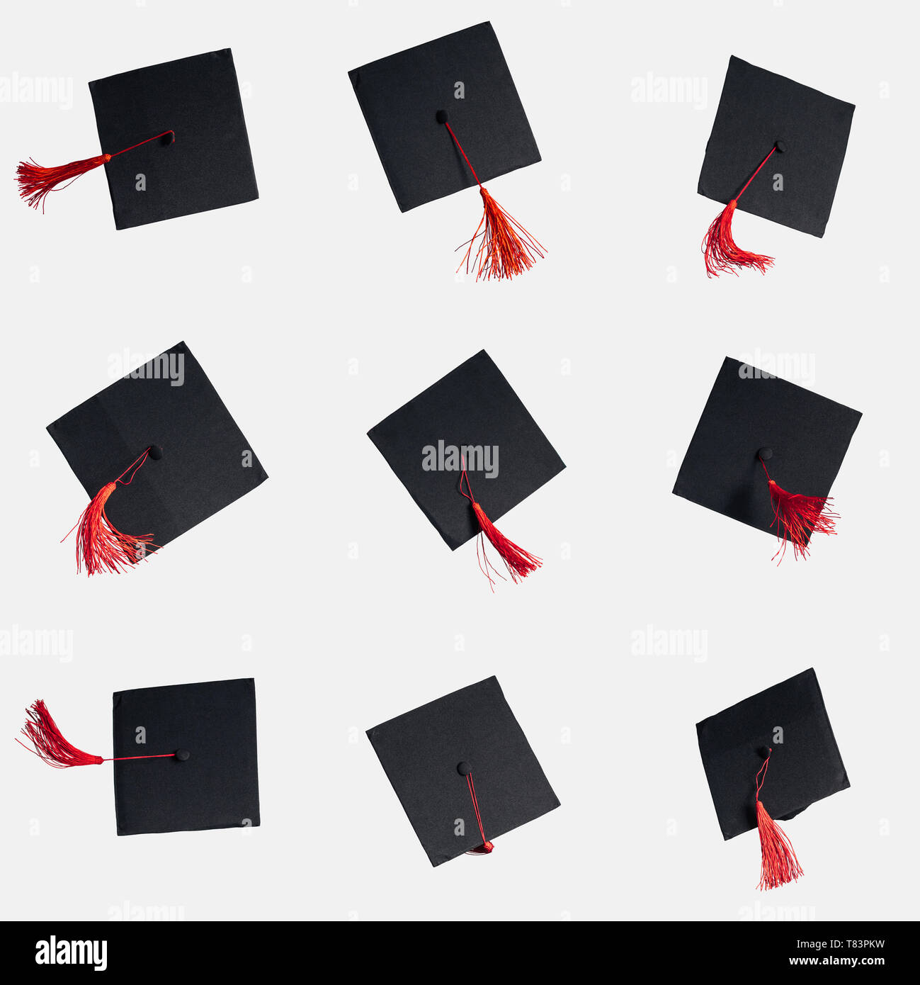 Black academic caps with red tassels isolated on white Stock Photo Alamy