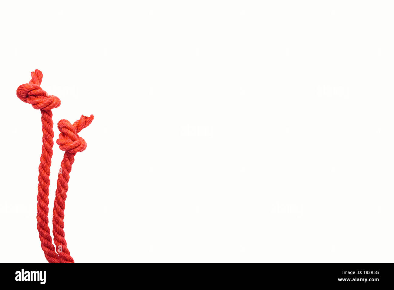 red jute ropes with knots isolated on white Stock Photo Alamy