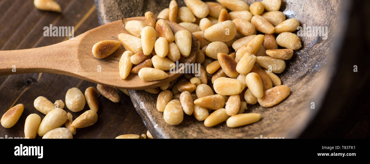 Pine Nuts on Dark Wooden Table. Toasted Organic Healthy Food Stock ...