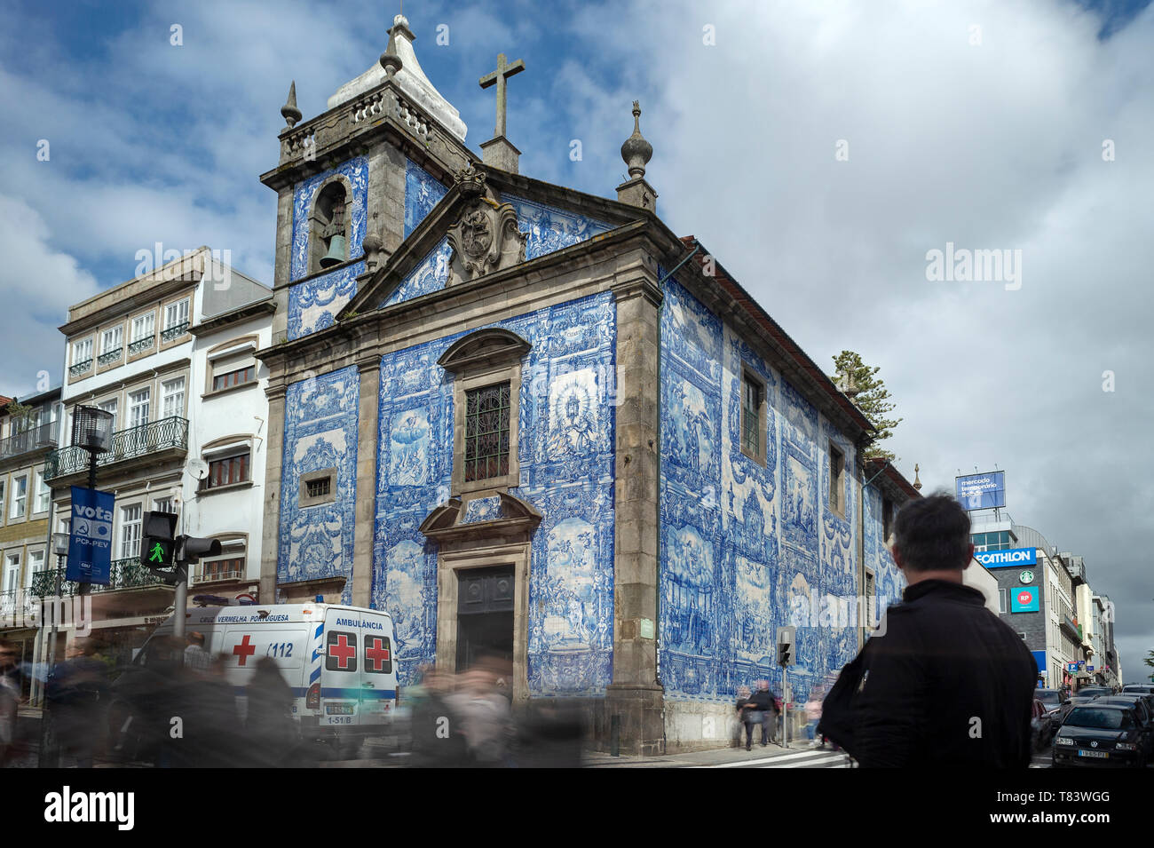 Capela das Almas Church in Porto, Portugal. Blue azulejo tiled exterior facade with blurred people. Stock Photo