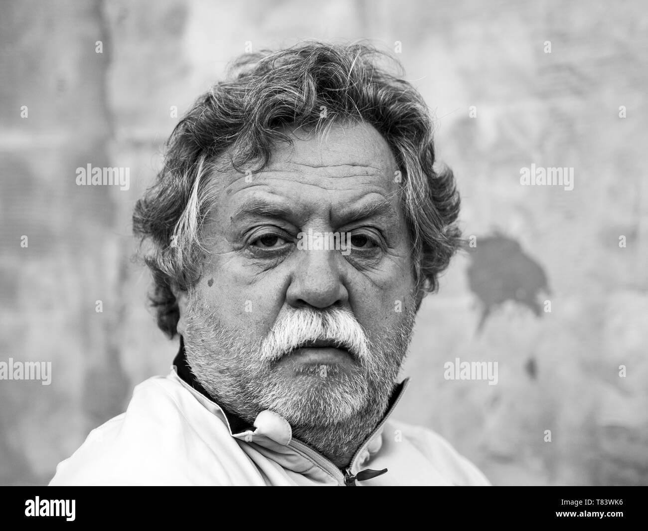 Black and white portrait of a middle aged caucasian man with gray hair ...