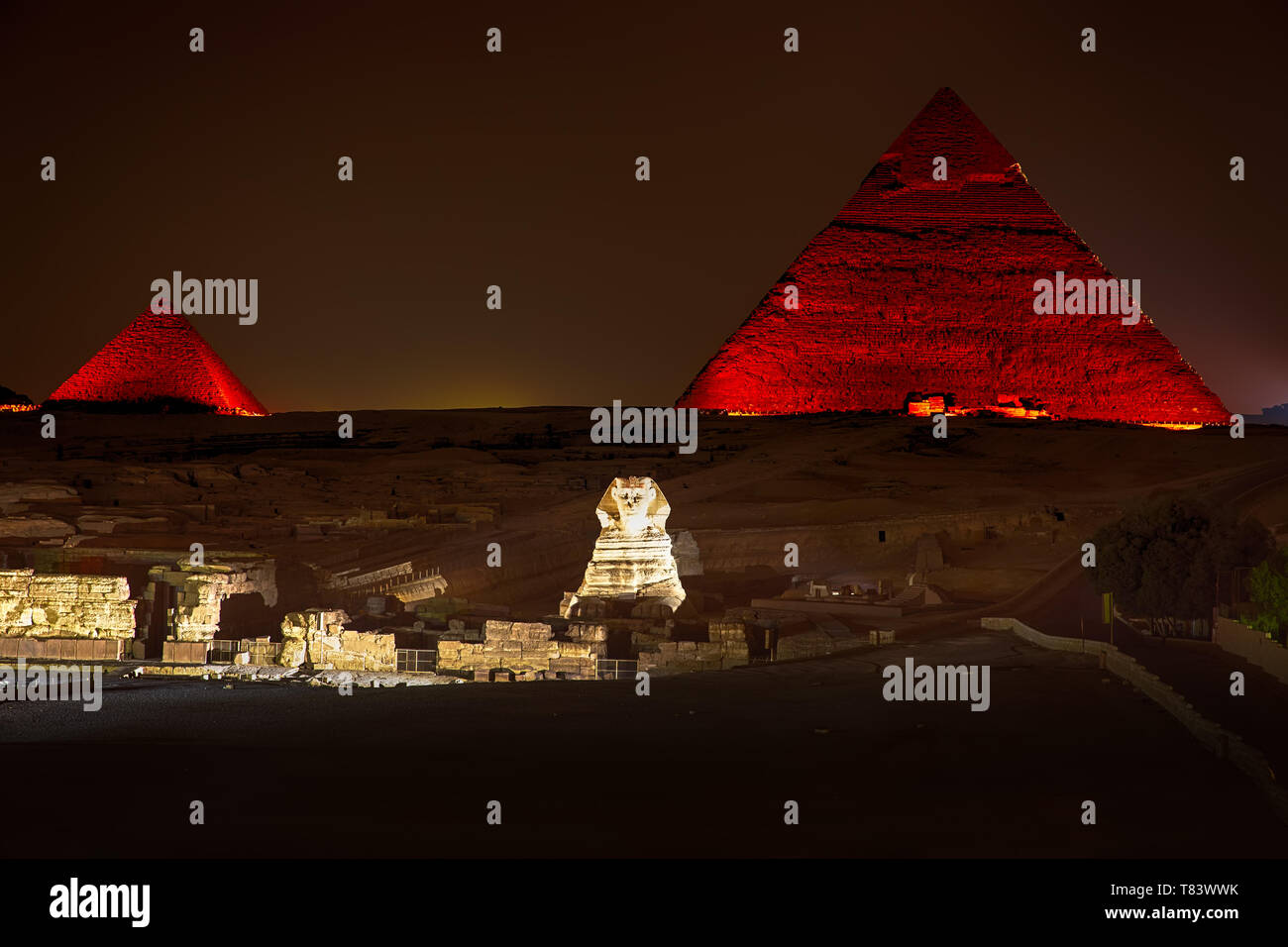 Night view on the enlighted Pyramids of Giza, Egypt Stock Photo