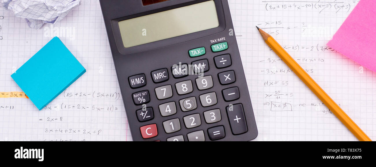 Handheld Calculator, Pencil, Ruler over Sheet of Paper with Mathematical  Formulas and Coffee Cup Imprint Stock Photo - Alamy