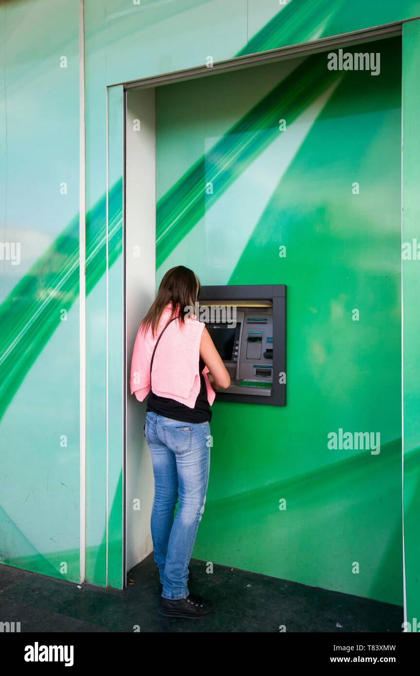 Turkey, Istanbul, Beyoglu, Taksim District, Taksim Square, woman at a cash machine Stock Photo