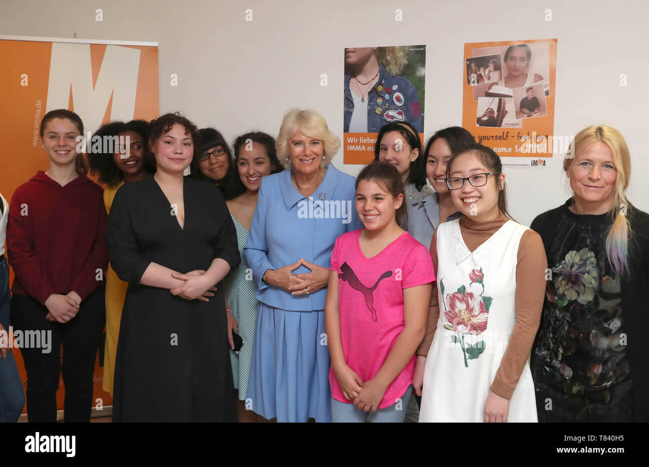 The Duchess of Cornwall stands young women during a visit to a women's refuge in Munich, on the last day of her tout of Germany. Stock Photo