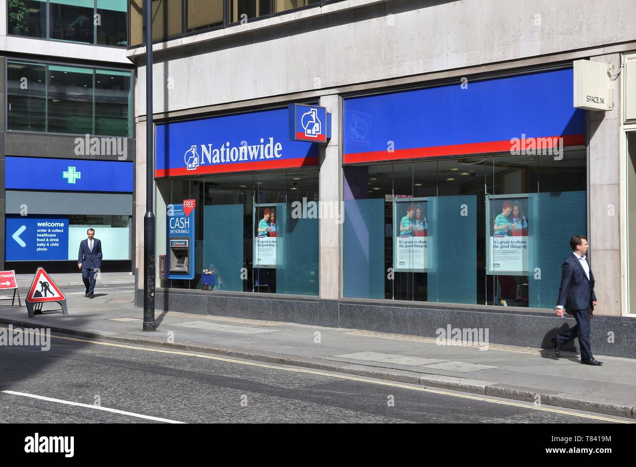 LONDON, UK - JULY 6, 2016: People walk by Nationwide Building Society in London. NBS is the largest building society in the world. It had 495.3 millio Stock Photo