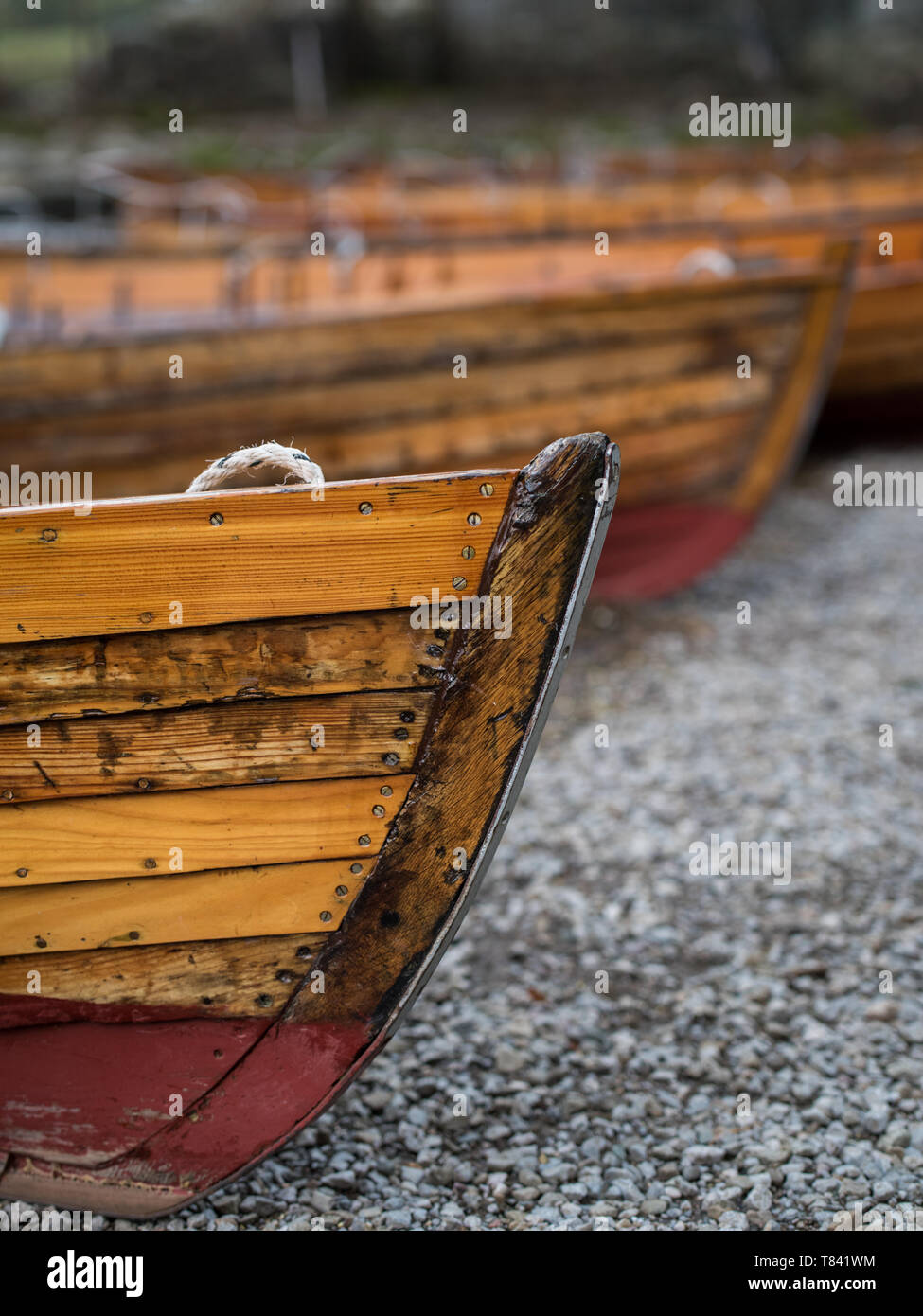 The fronts of wooden canoes on the shore of Derwentwater at Keswick, Lake District, Cumbria, UK Stock Photo