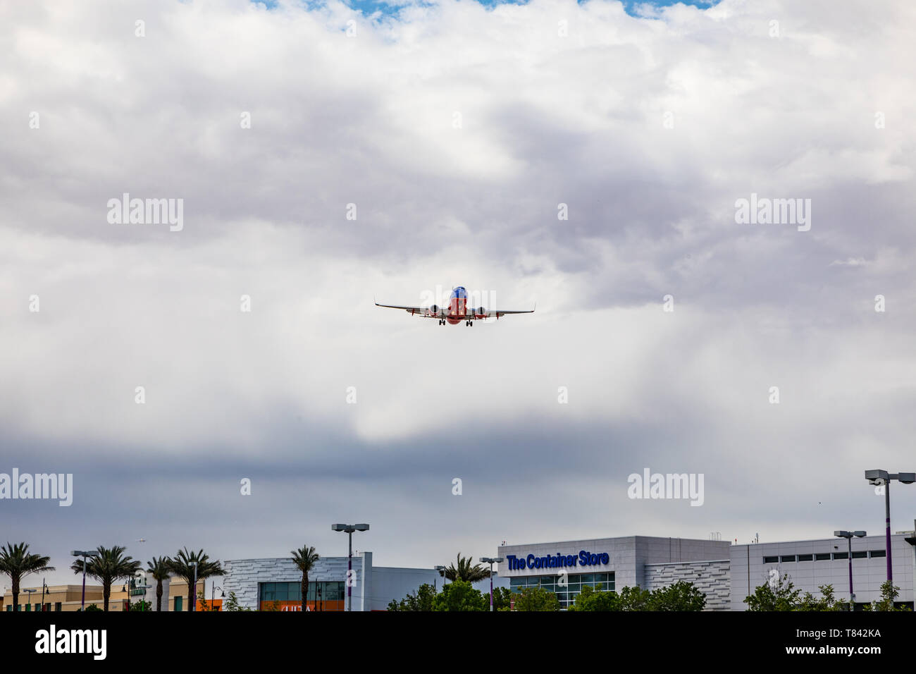 Airplanes landing at McCarran airport in Las Vegas Nevada at a very low  altitude over the Town Square shopping mall Stock Photo - Alamy