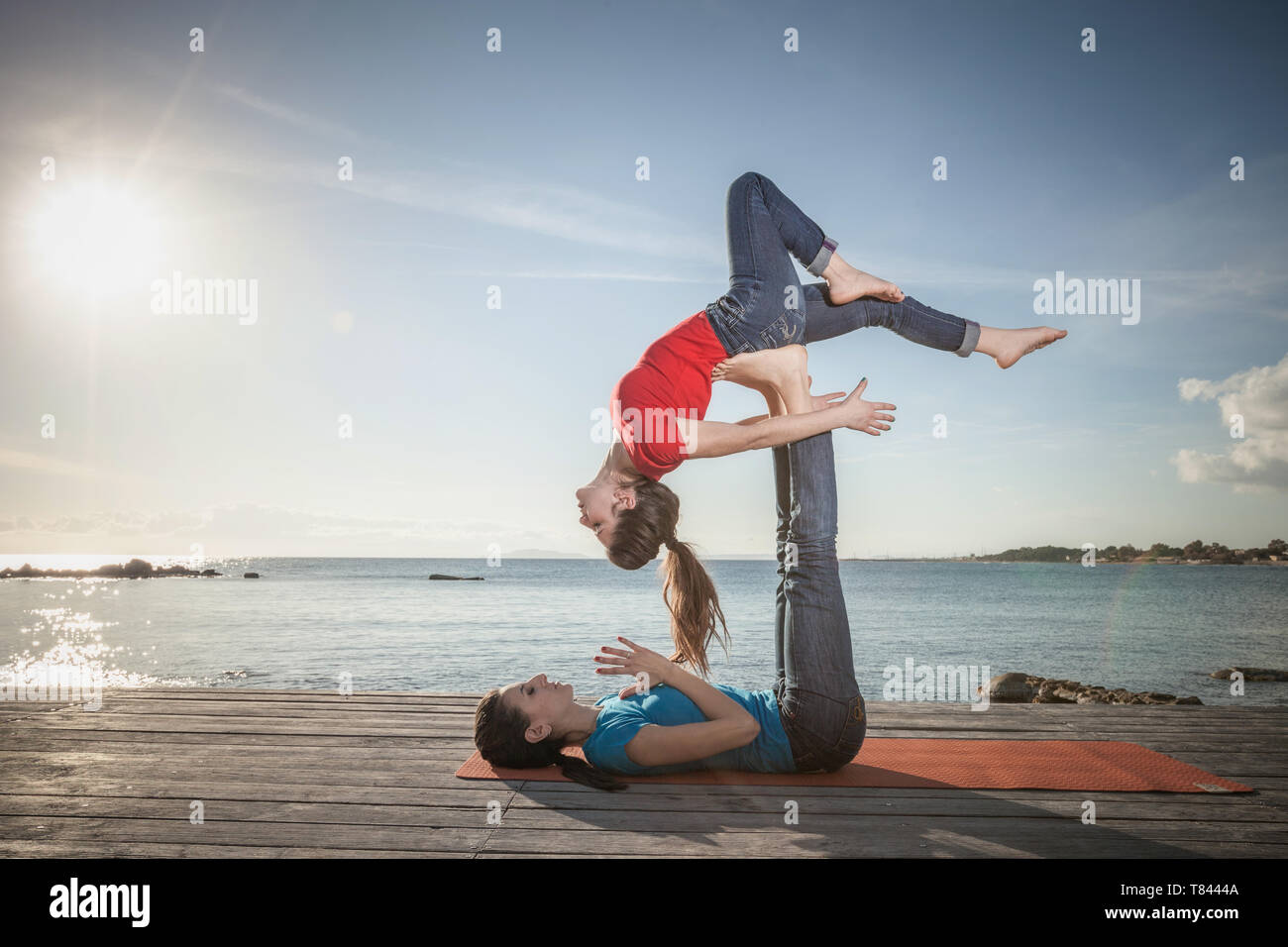 Women yoga bending over hi-res stock photography and images - Alamy