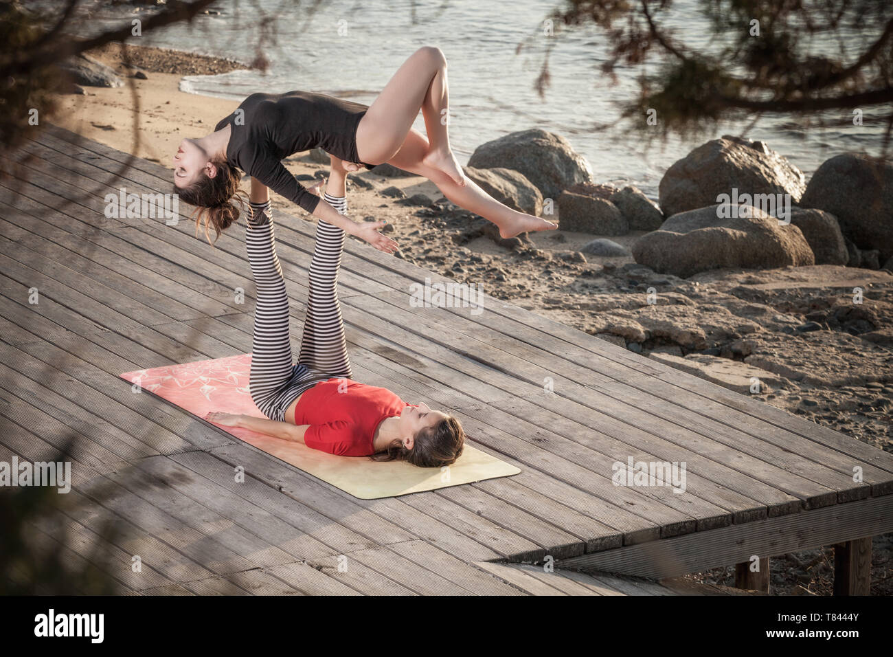 Women yoga bending over hi-res stock photography and images - Alamy