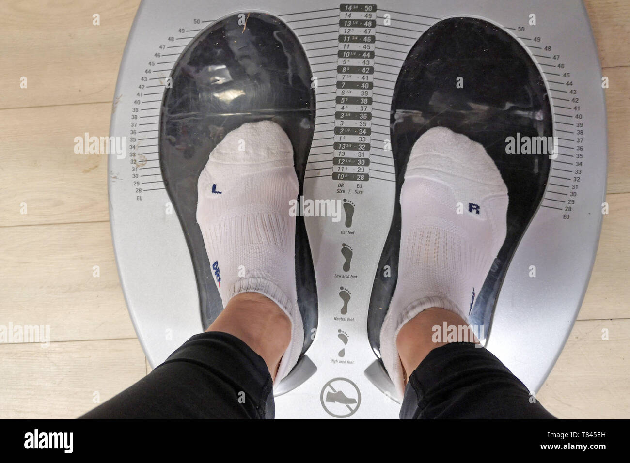 Measuring foot size at Sports Direct in Stratford upon Avon, Warwickshire, UK, on May 9, 2019. Stock Photo