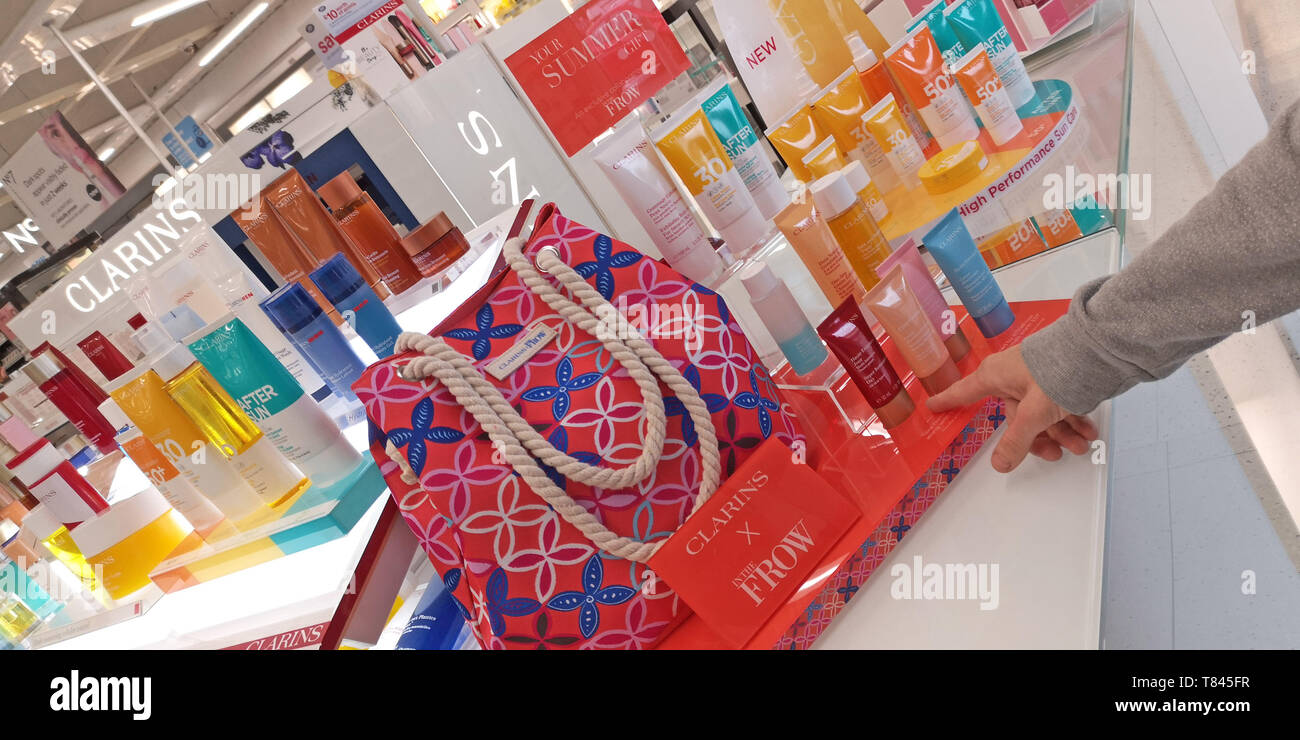 A customer looks at beauty products on the Clarins promotional stand in a  branch of Boots in Stratford upon Avon, Warwickshire, UK, on May 9, 2019  Stock Photo - Alamy