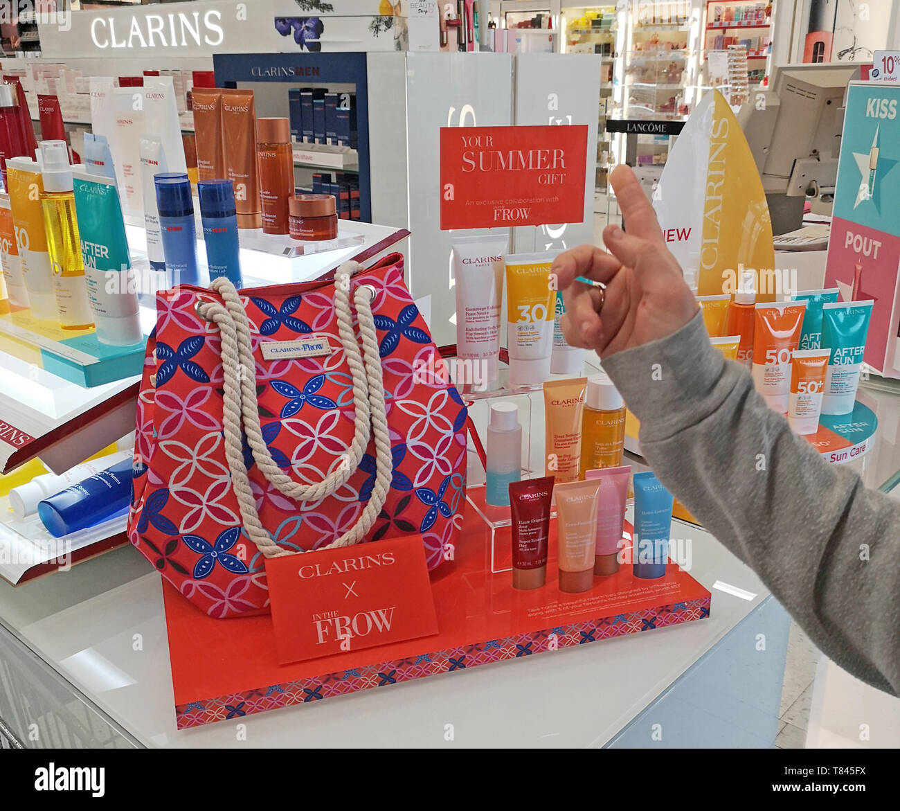 A customer looks at beauty products on the Clarins promotional stand in a  branch of Boots in Stratford upon Avon, Warwickshire, UK, on May 9, 2019  Stock Photo - Alamy