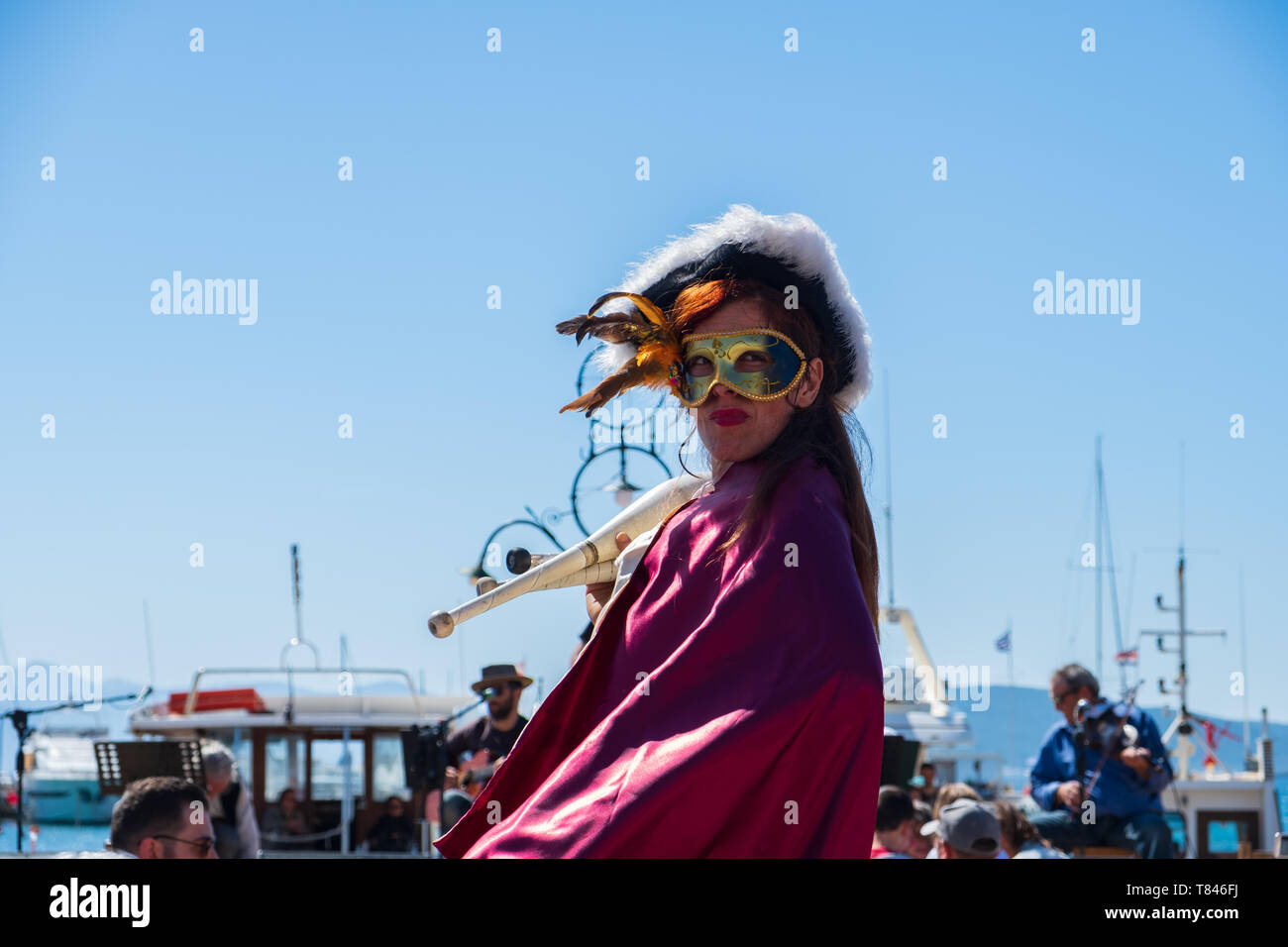Athens, Greece March 10, 2019 A woman wearing a mask parades wearing
