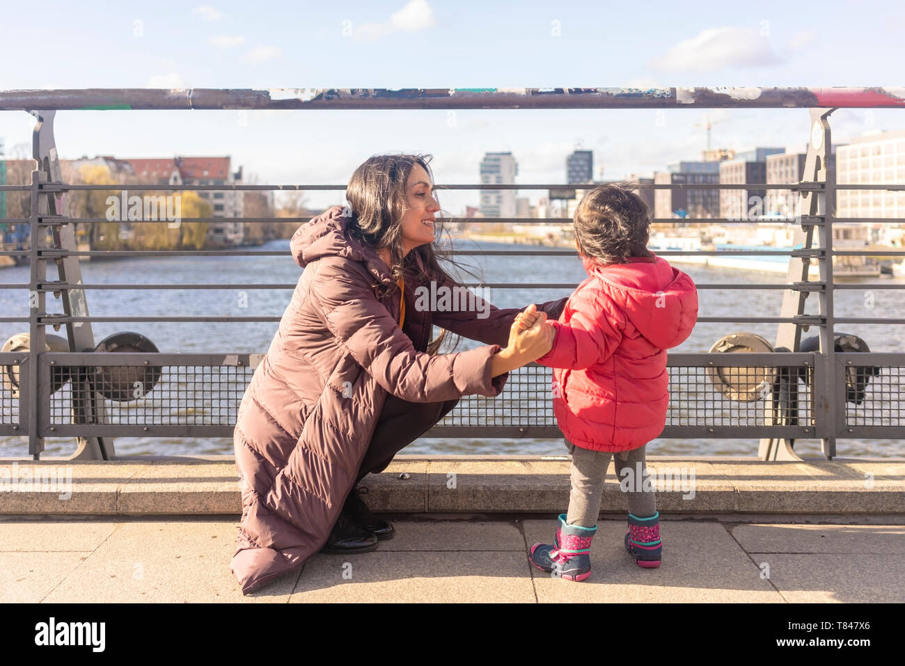 Mother and daughter by river, Berlin, Germany Stock Photo