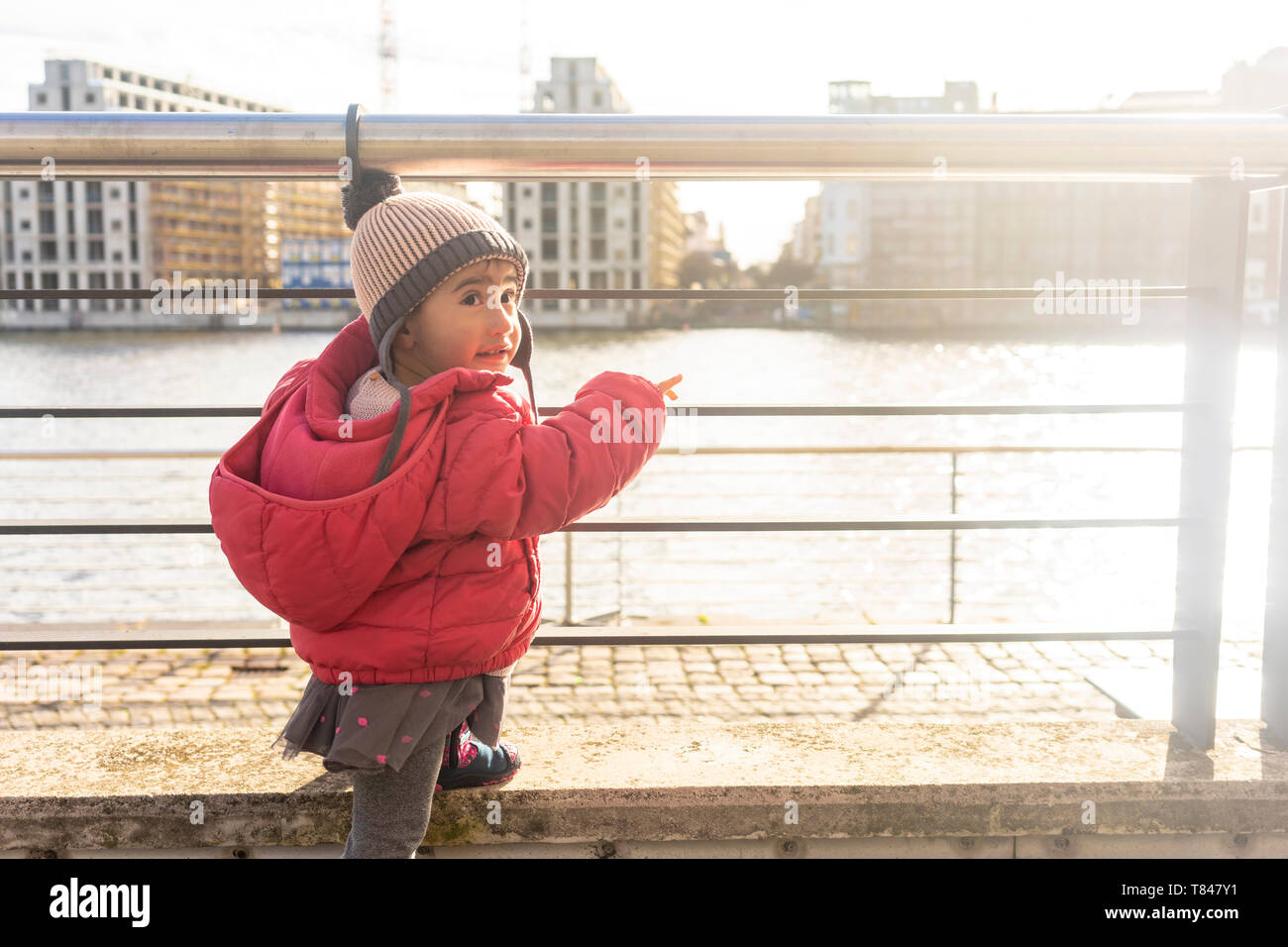 Little girl by river, Berlin, Germany Stock Photo