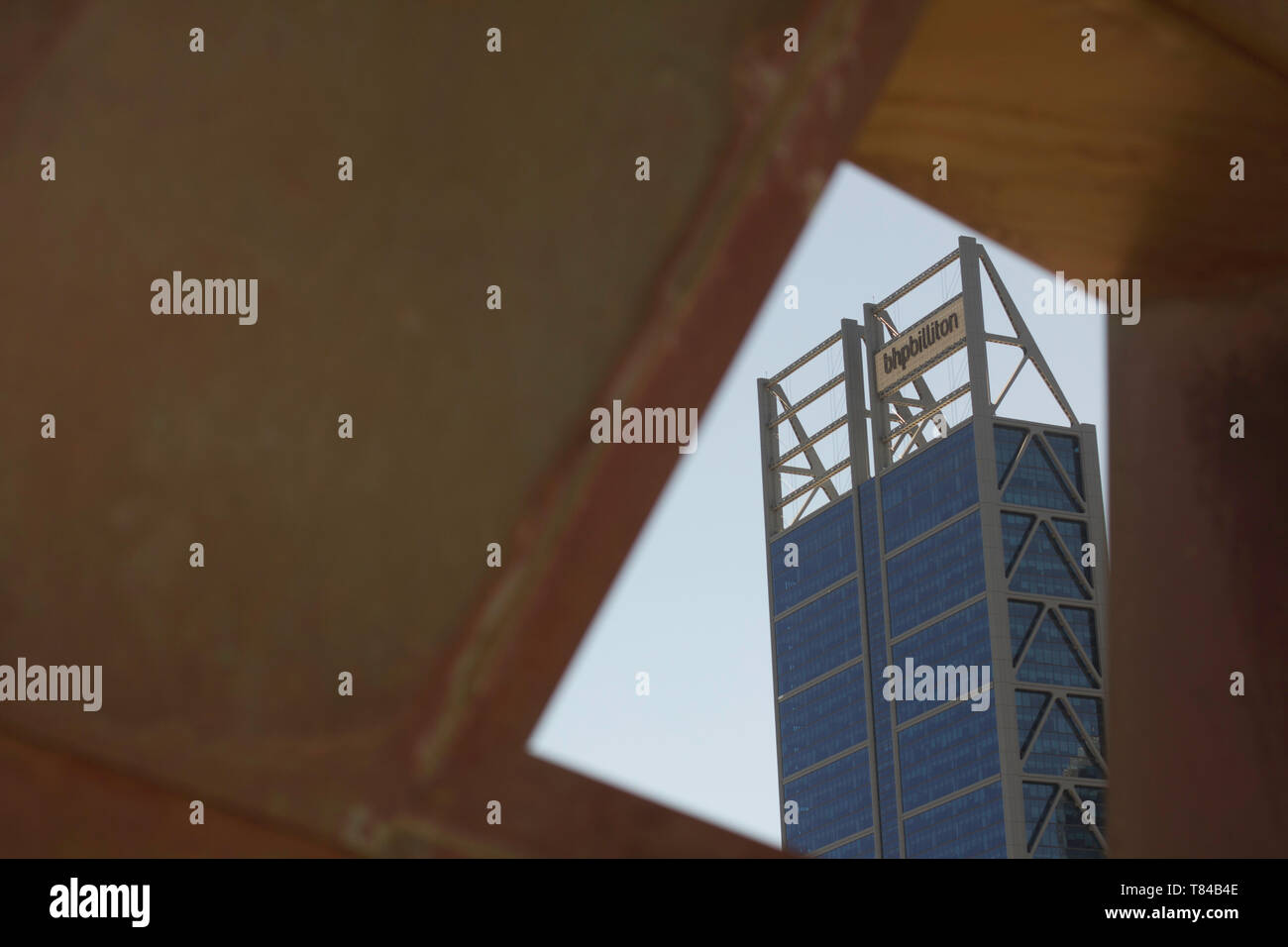 Perth, Western Australia, Australia -17/01/2013 : View of iconic city of perth building Bhp Billiton from a hole in a metal wall of The Swan Bell Tow Stock Photo