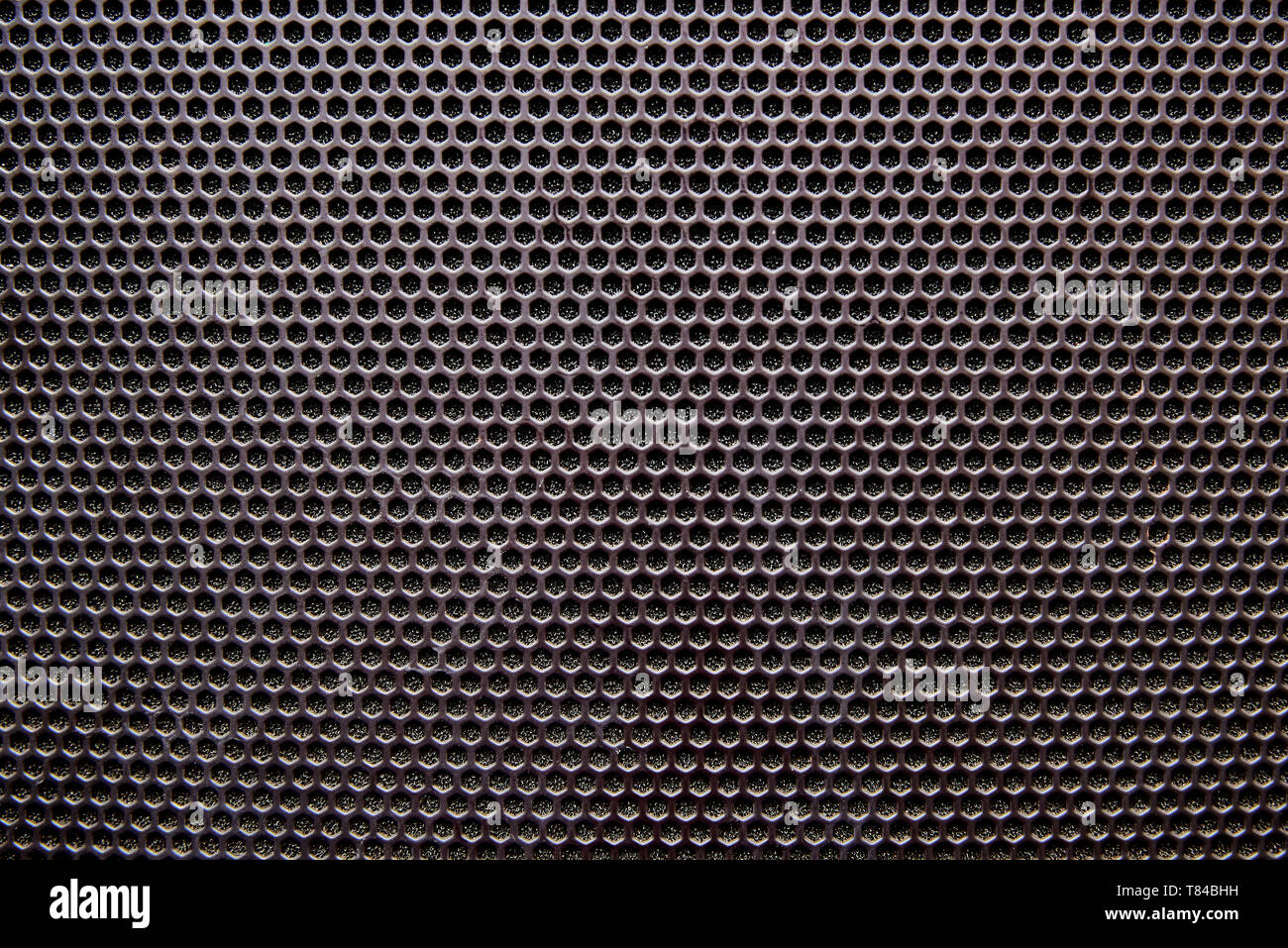 Black background speaker grille close-up. Stock Photo