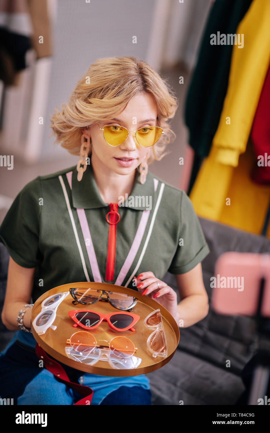 Blonde Stylist With Short Wavy Hair Filming Blog About Sunglasses